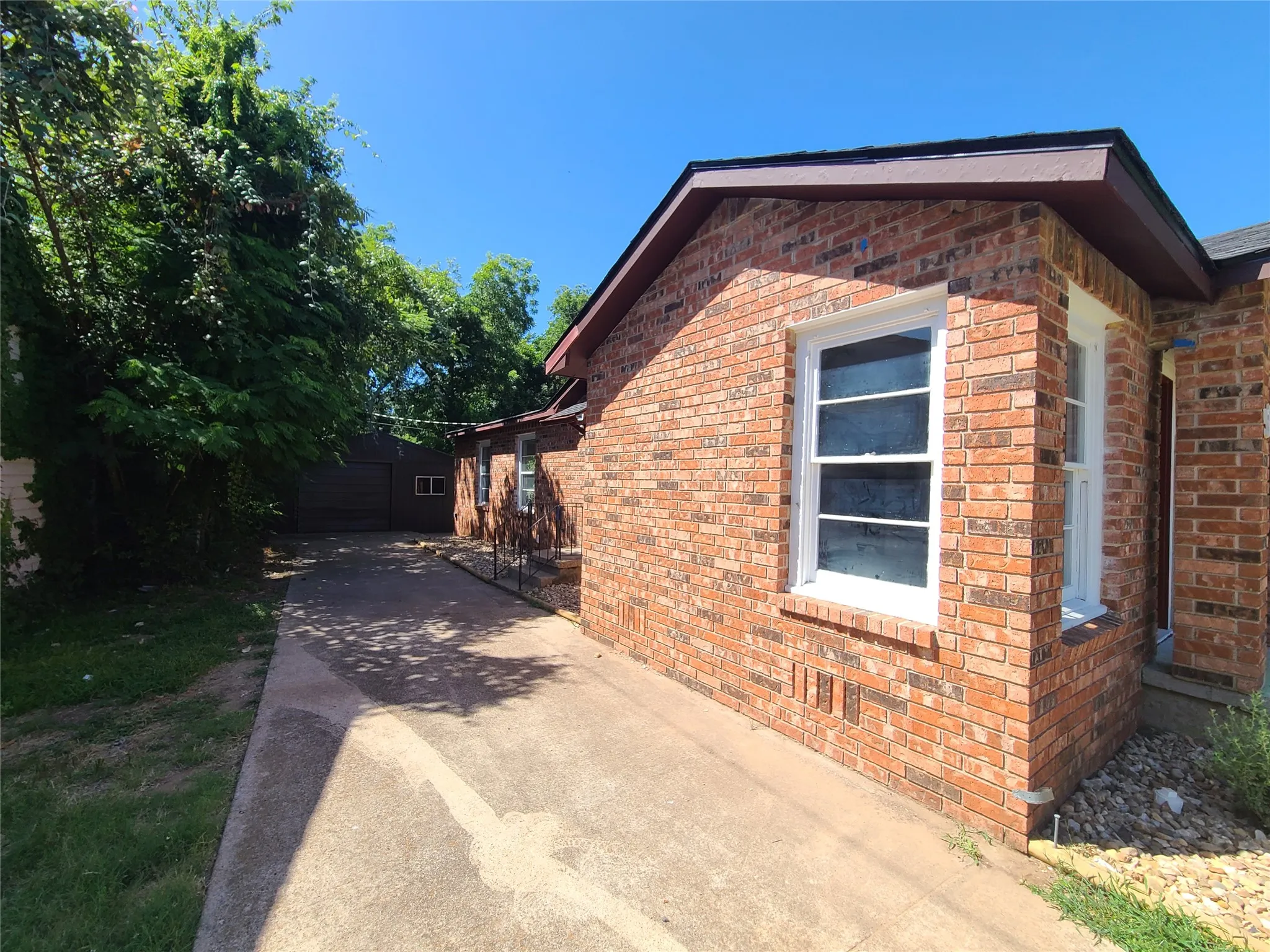 Nice Long Driveway for plenty of cars! Detached 1 car garage with storage area.