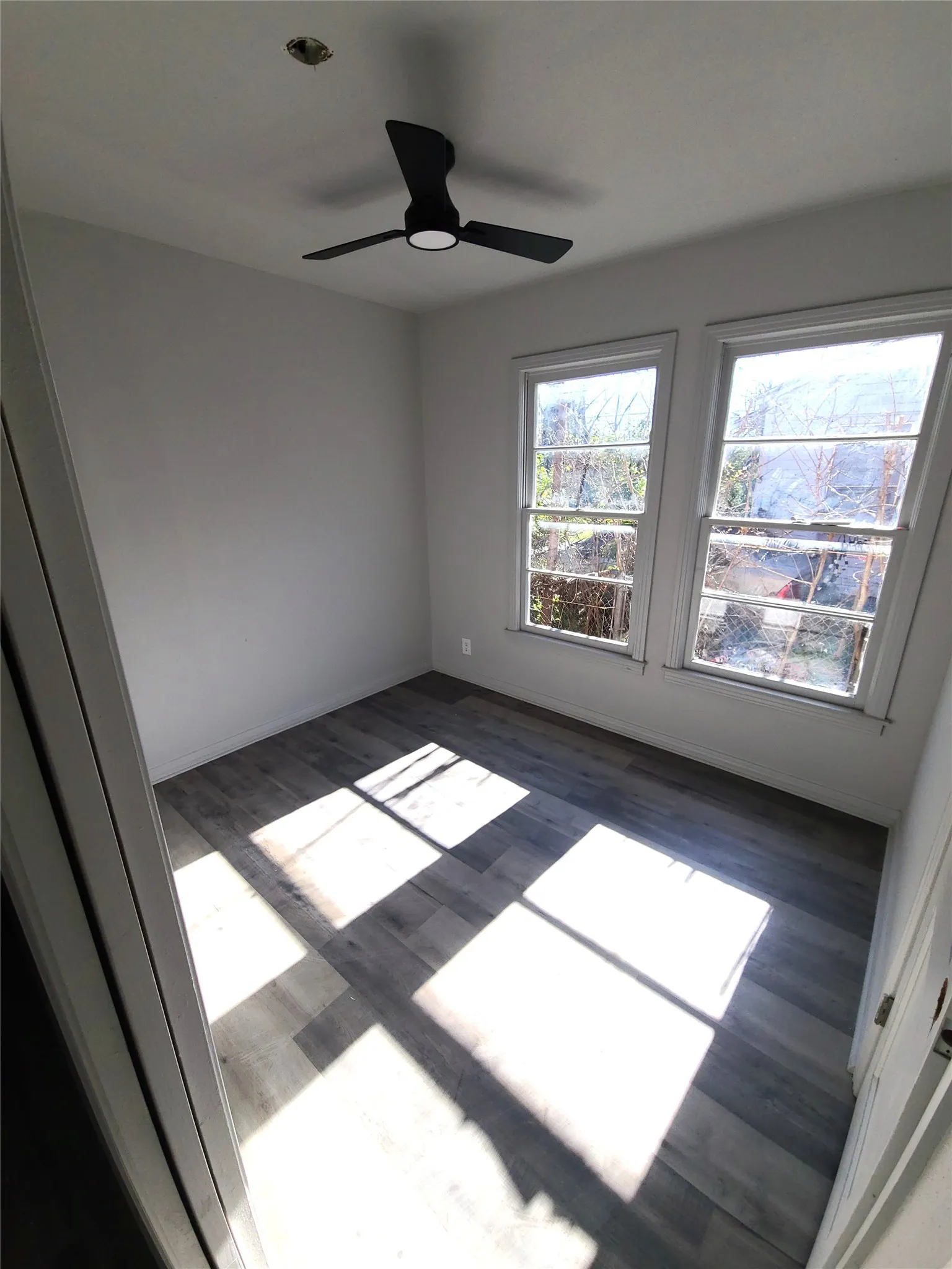 Bedroom #3 featuring ceiling fan and dark wood-style flooring