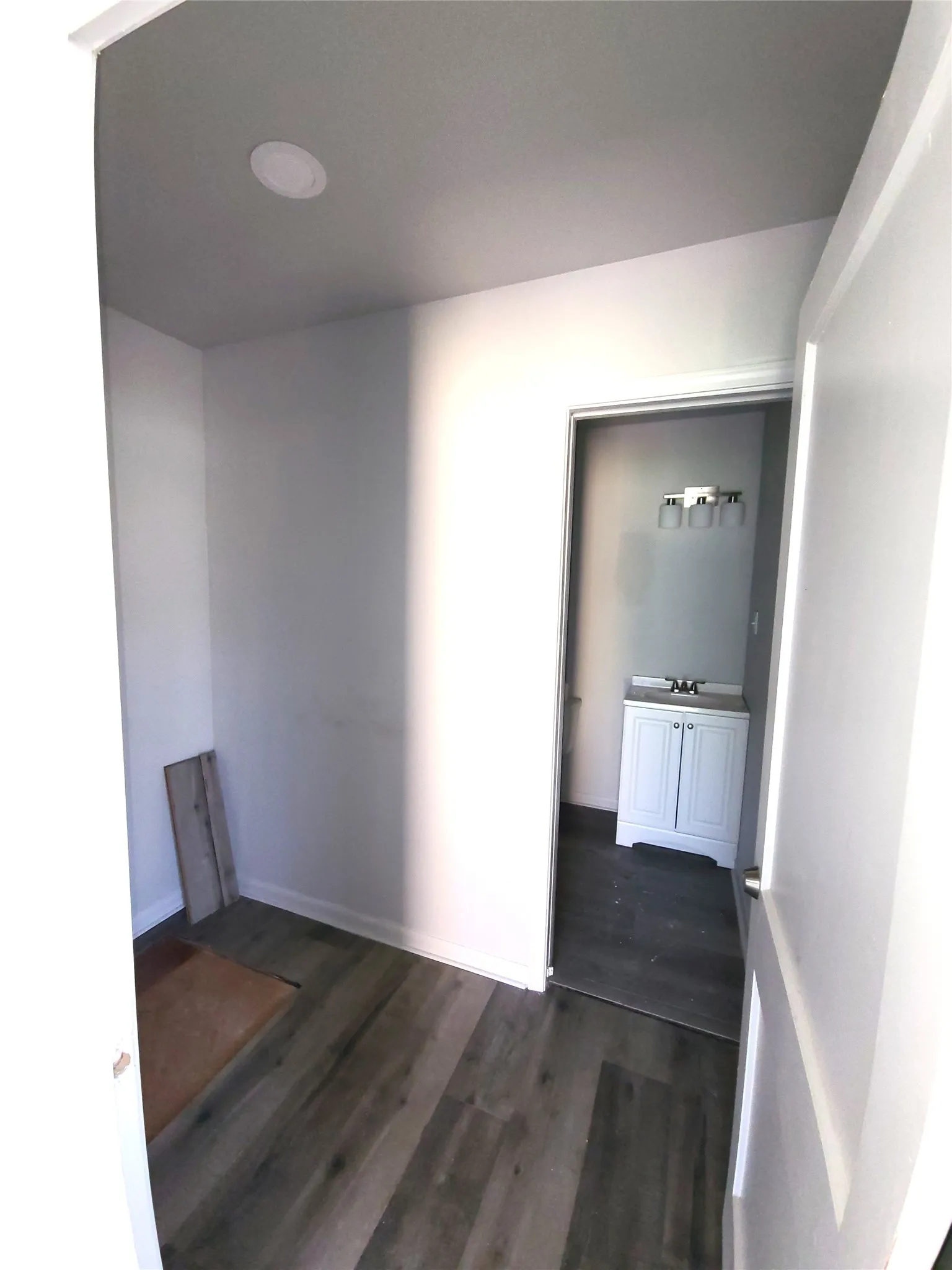 Primary Closet leading to the primary private bathroom.