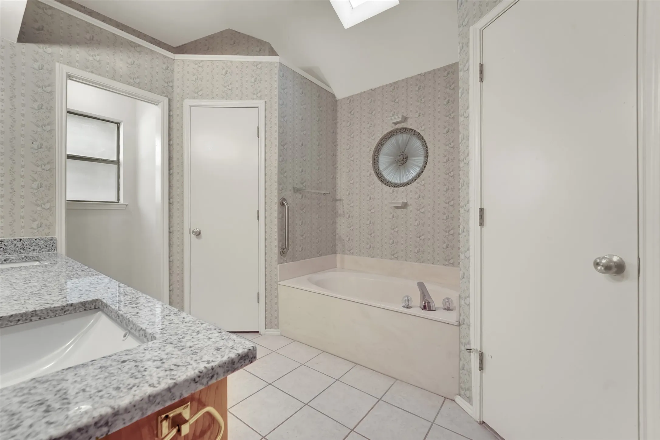Dual vanity with granite-style countertops and undermount sinks