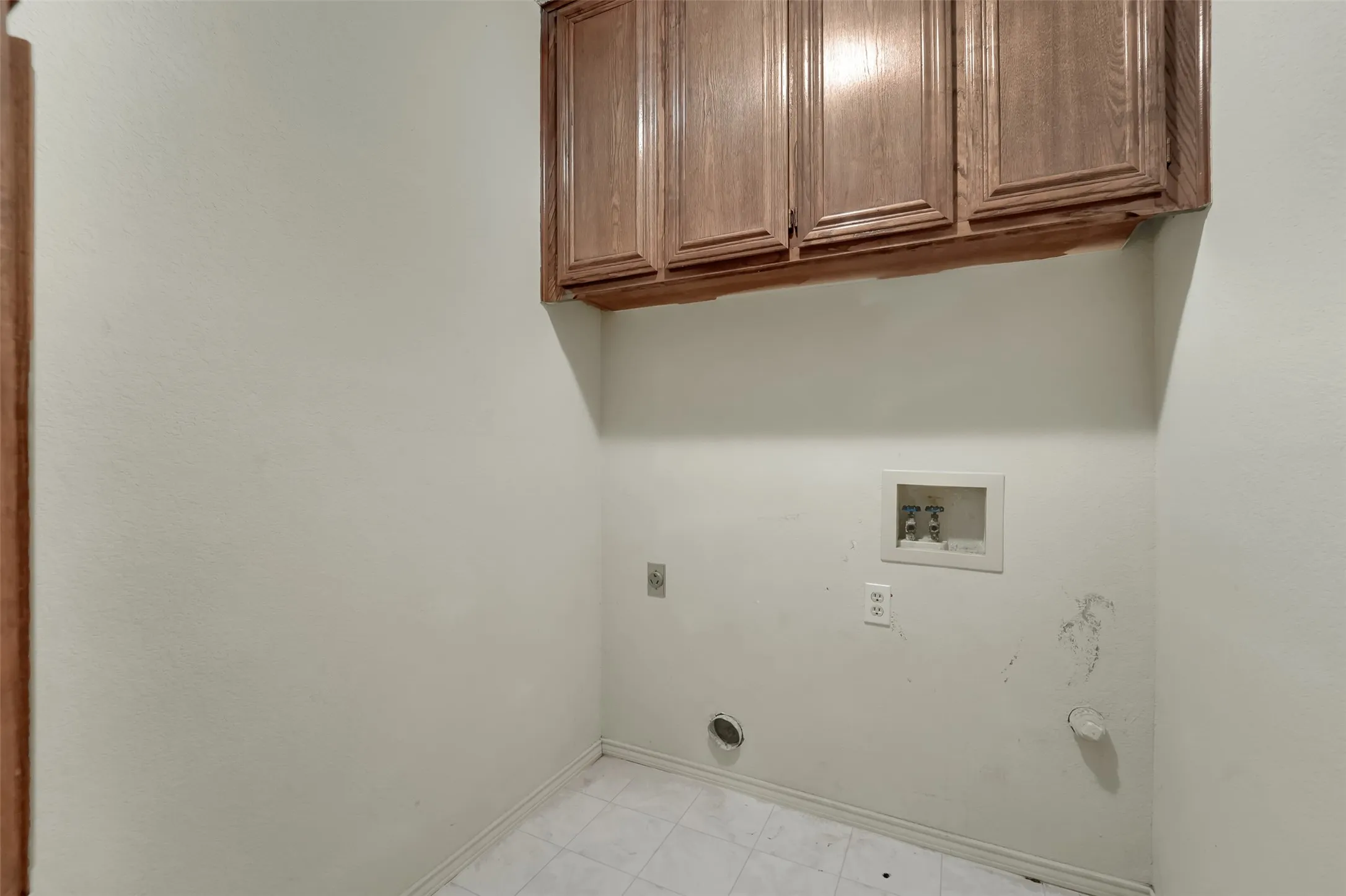 Wood-finish cabinetry offers storage solutions