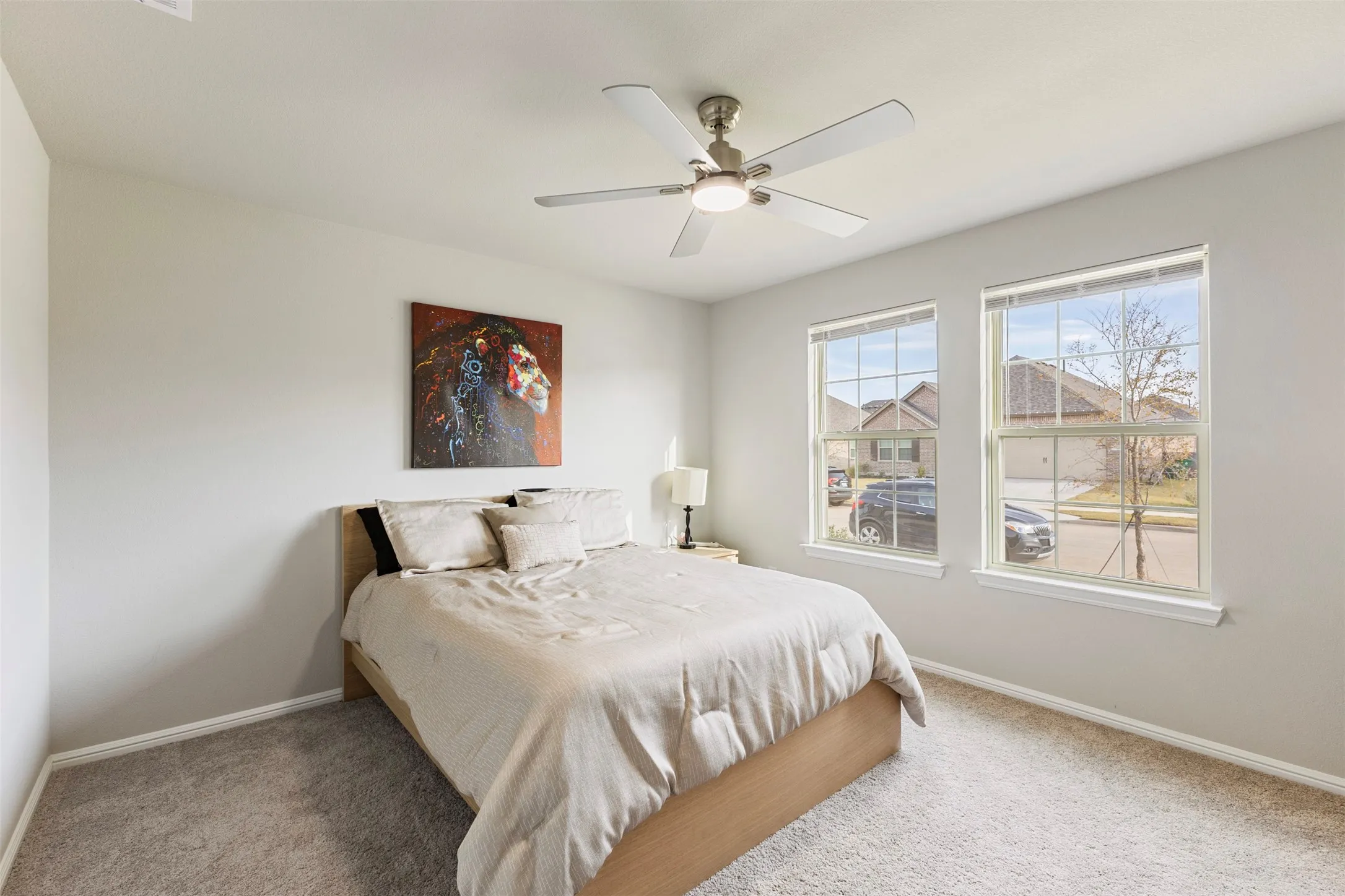 Bedroom featuring carpet and ceiling fan