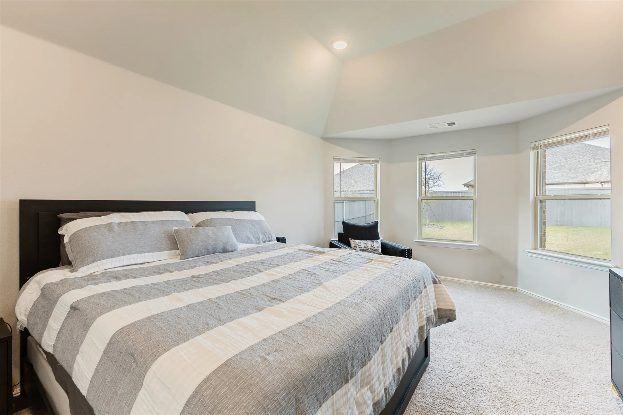 Bedroom featuring baseboards and carpet floors
