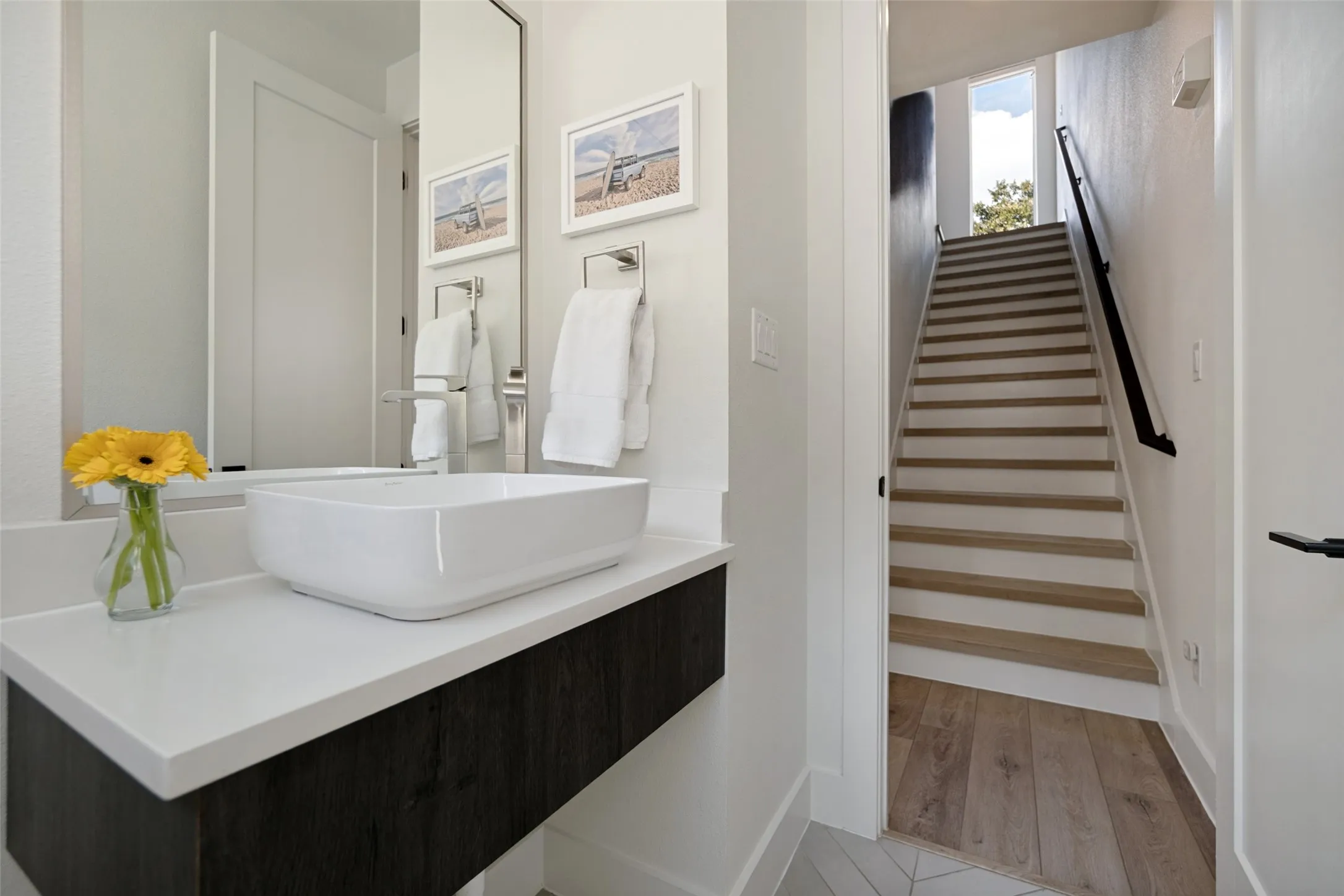 Half bath on second floor with kitchen and living room