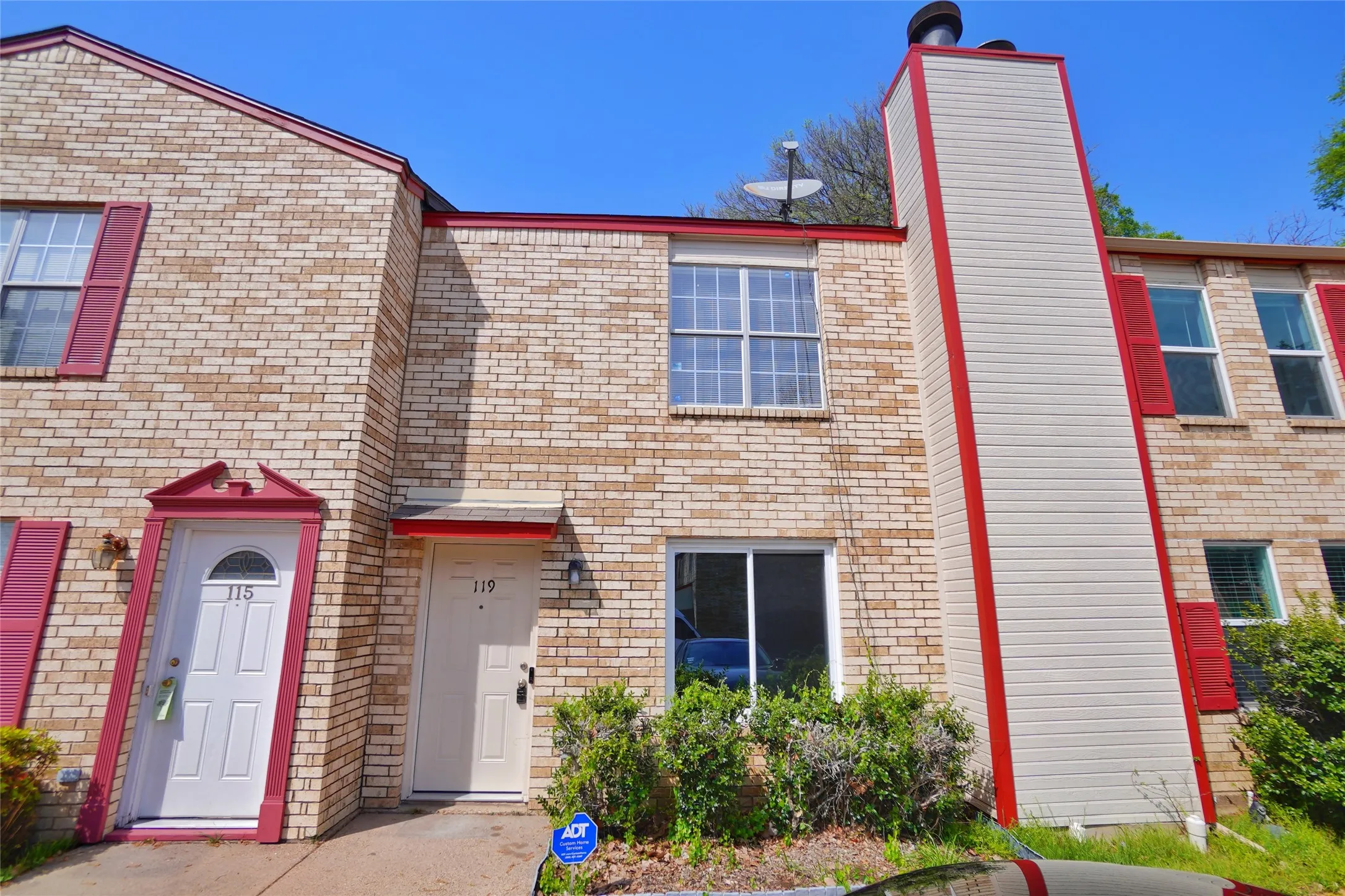 Brick facade with red trim accents