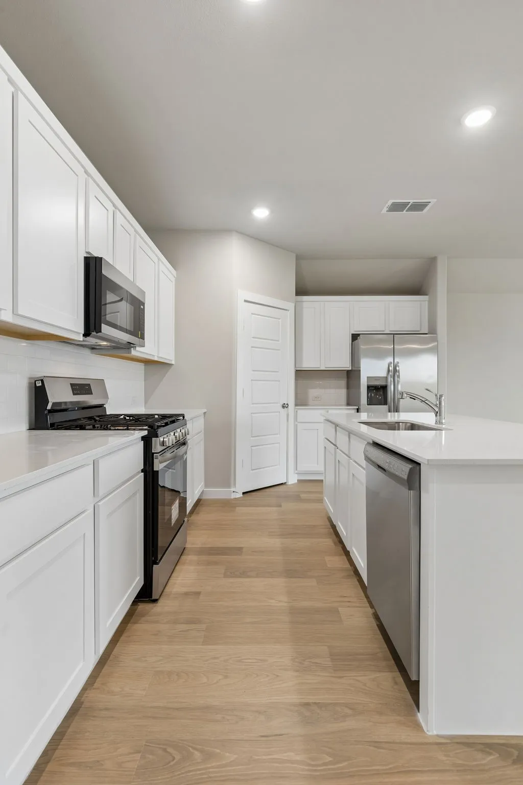 Kitchen in the Emmy II home plan by Trophy Signature Homes - REPRESENTATIVE PHOTO