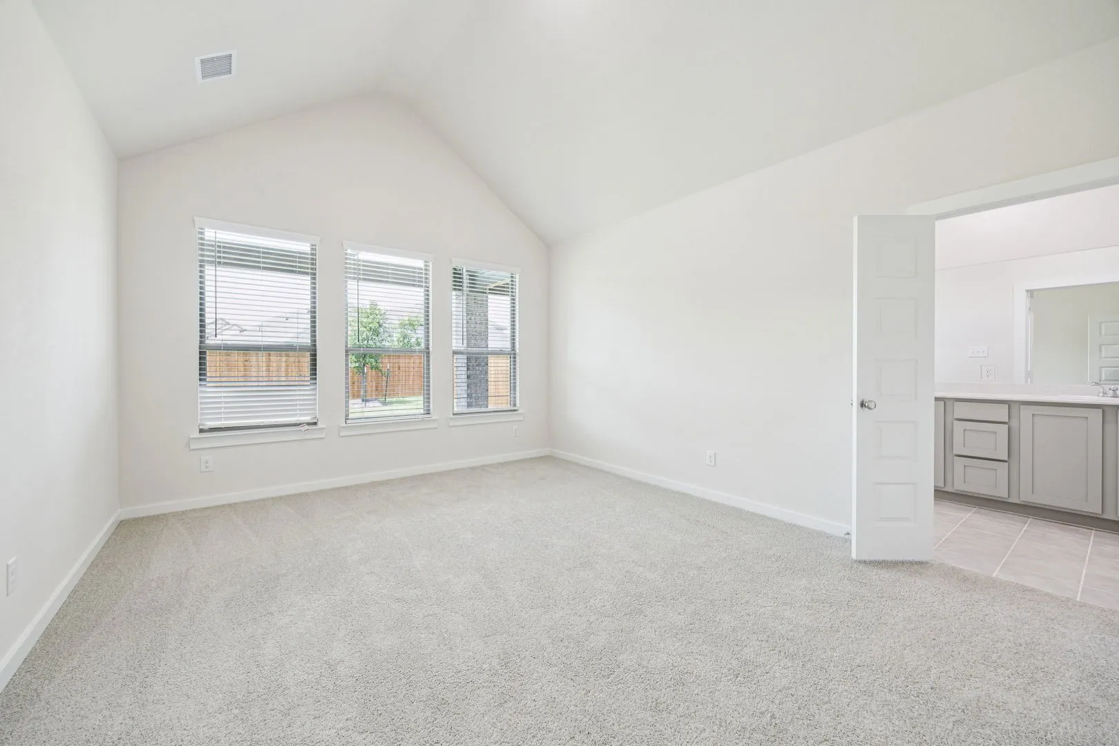 Primary Suite in the Claret home plan by Trophy Signature Homes – REPRESENTATIVE PHOTO
