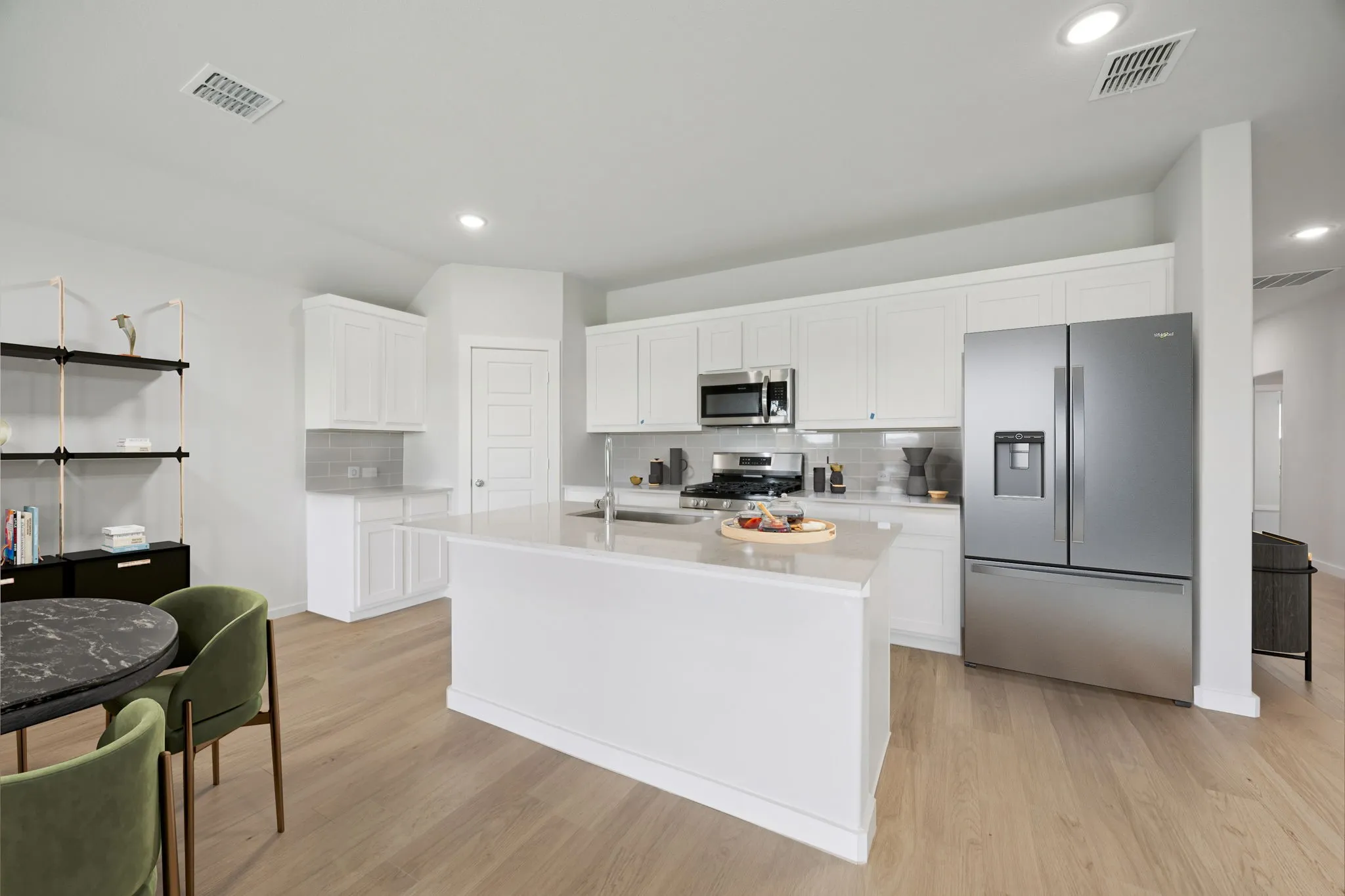 Kitchen in the Hadley home plan by Trophy Signature Homes – REPRESENTATIVE PHOTO