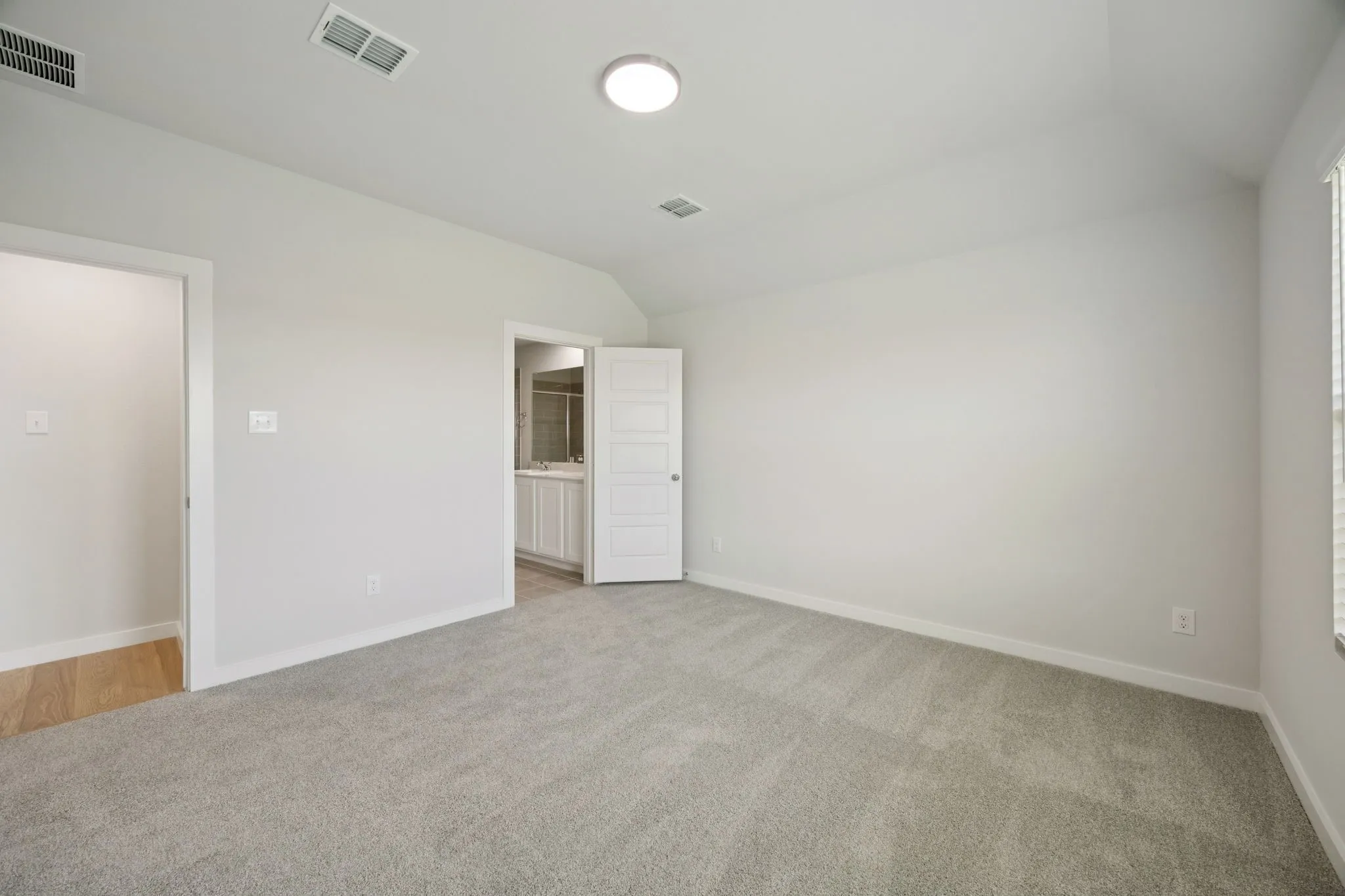 Primary Suite in the Hadley home plan by Trophy Signature Homes – REPRESENTATIVE PHOTO