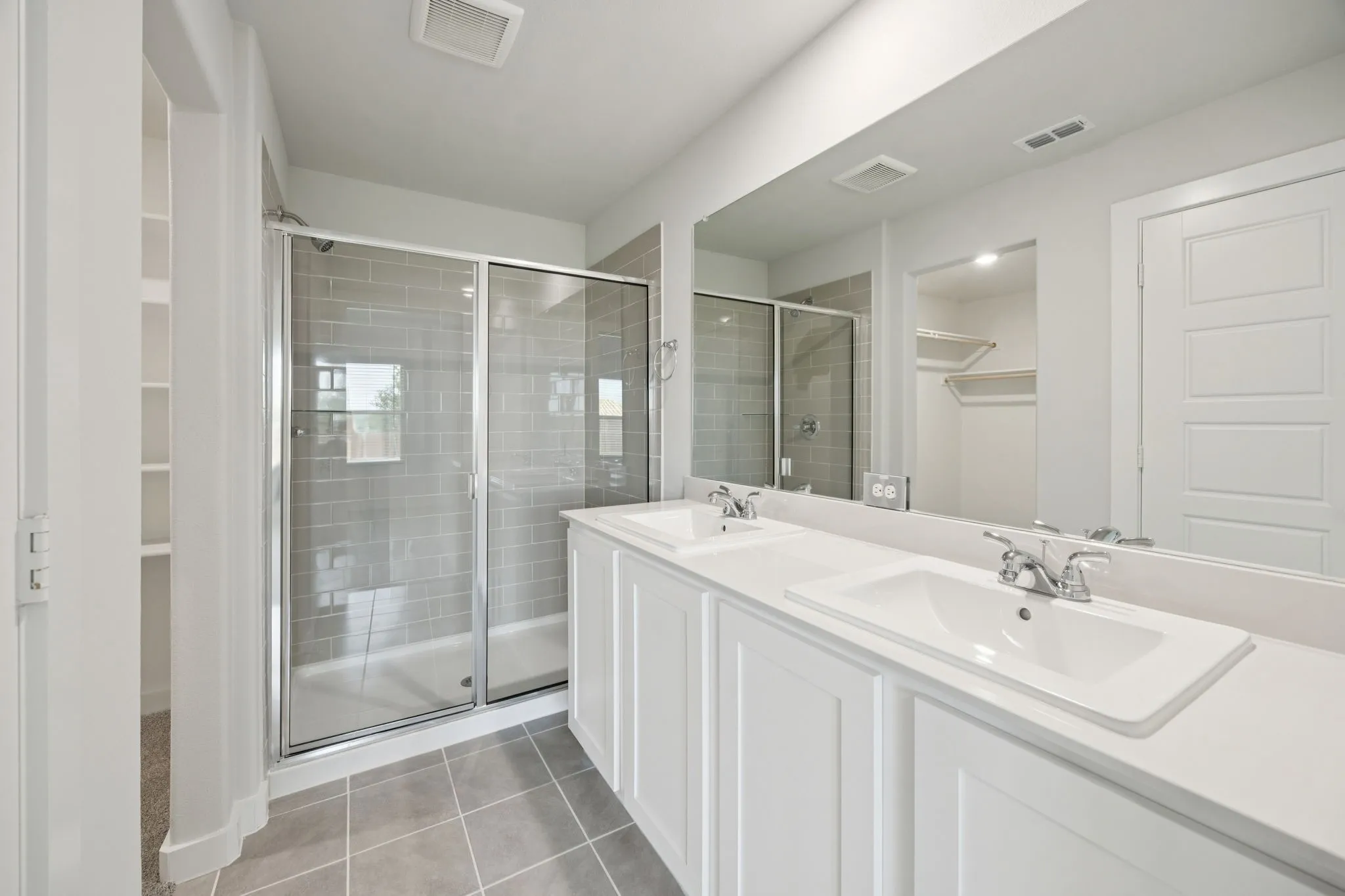 Primary Bathroom in the Hadley home plan by Trophy Signature Homes – REPRESENTATIVE PHOTO
