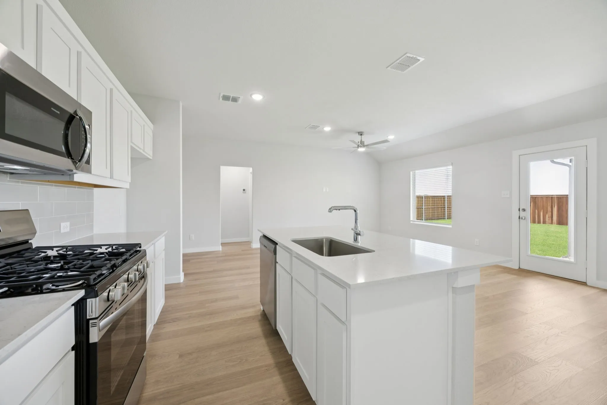 Kitchen in the Hadley home plan by Trophy Signature Homes – REPRESENTATIVE PHOTO
