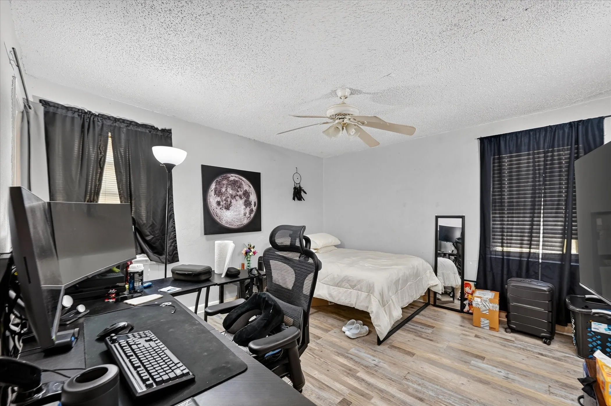 Wood-finish flooring throughout the room