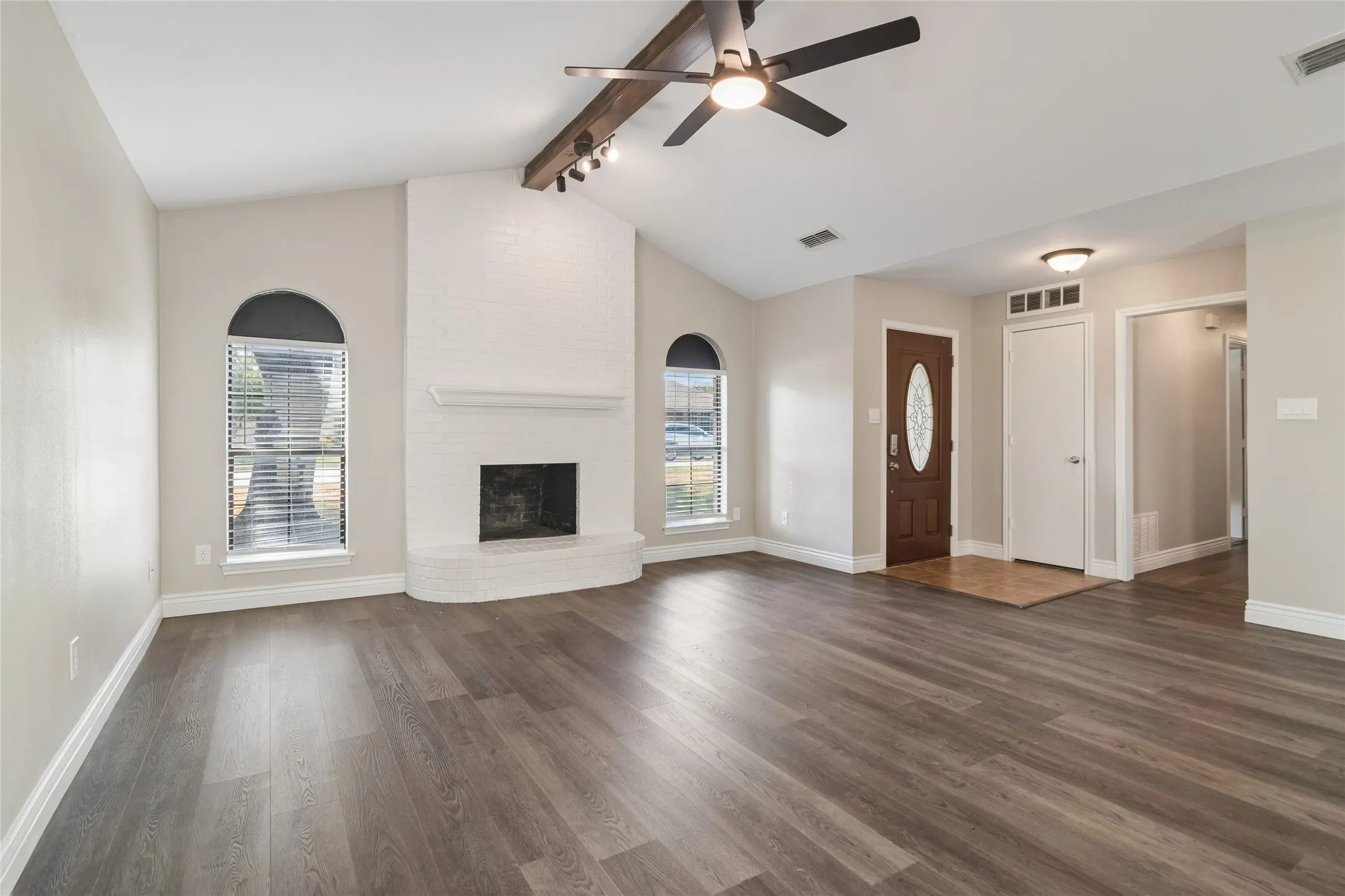 Living Room with brick wood burning fire place