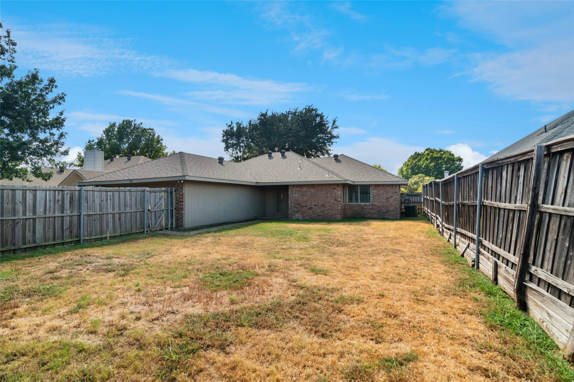 Large back yard with covered patio