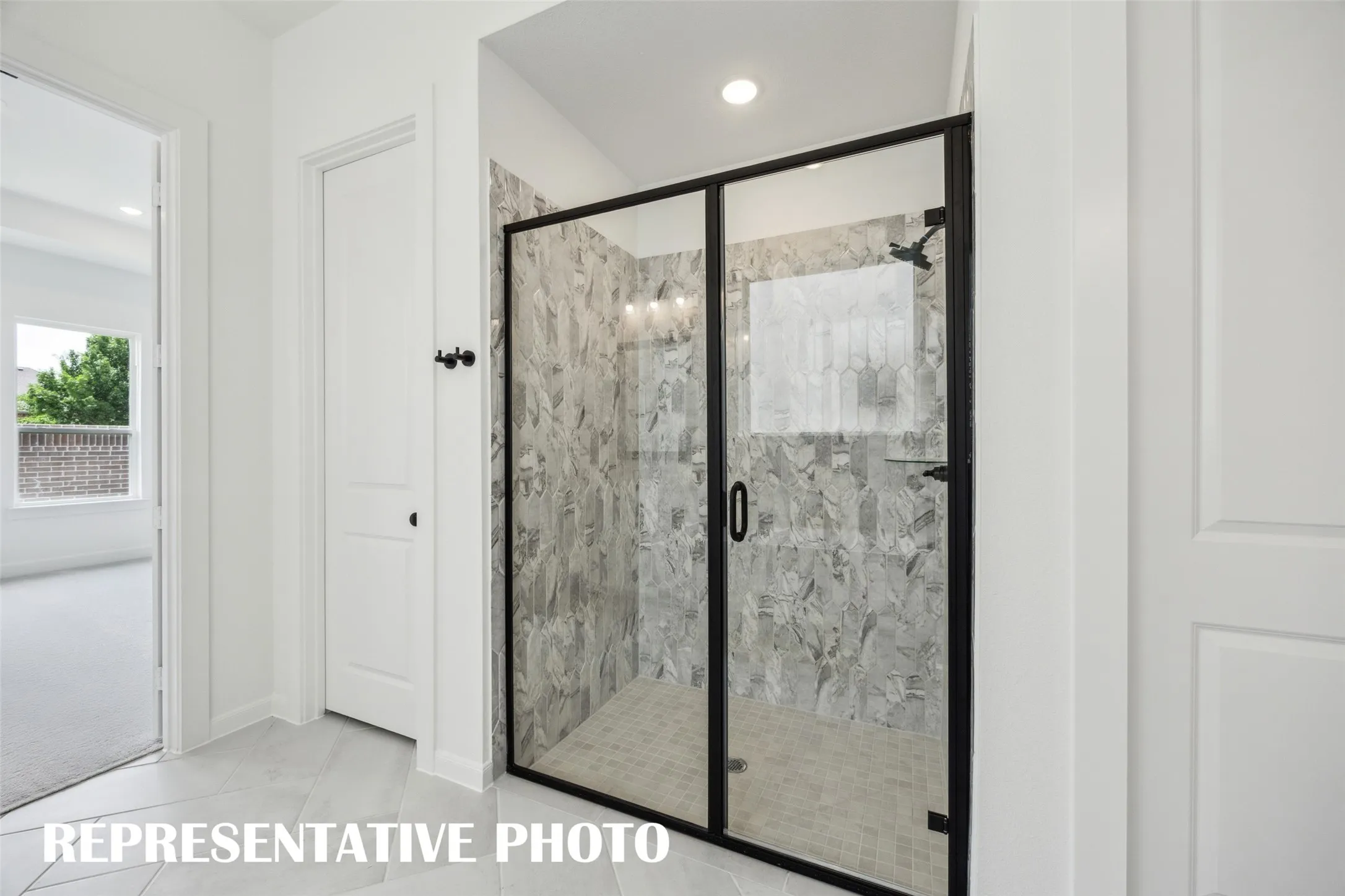 This spacious walk in shower is only one fantastic feature in this dream owner's bath! REPRESENTATIVE PHOTO