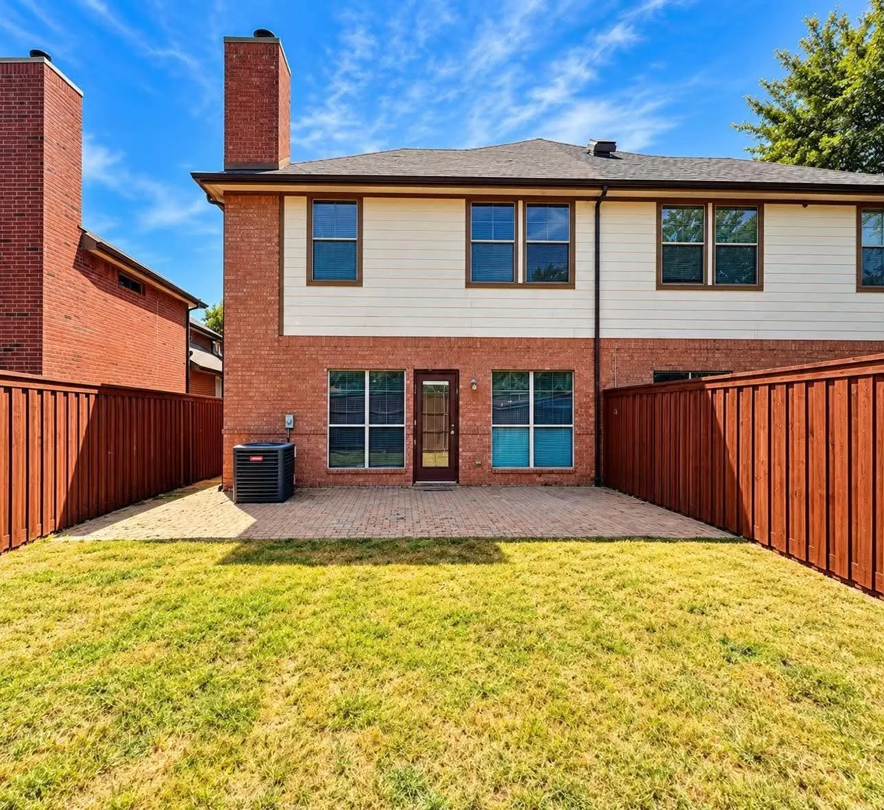 Brick exterior with a second story of horizontal siding