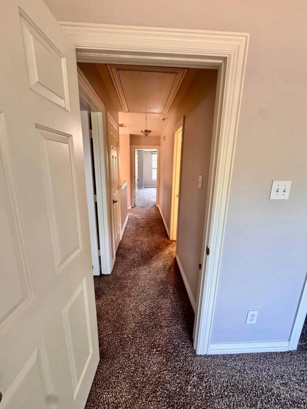 Recessed ceiling panel, overhead lighting fixture, and carpeted flooring