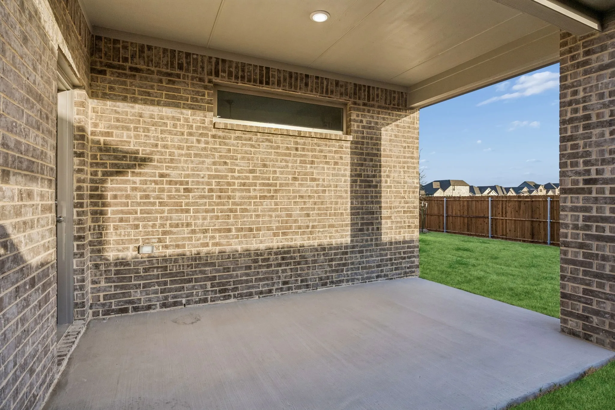 Covered Patio in the Wimbledon home plan by Trophy Signature Homes – REPRESENTATIVE PHOTO