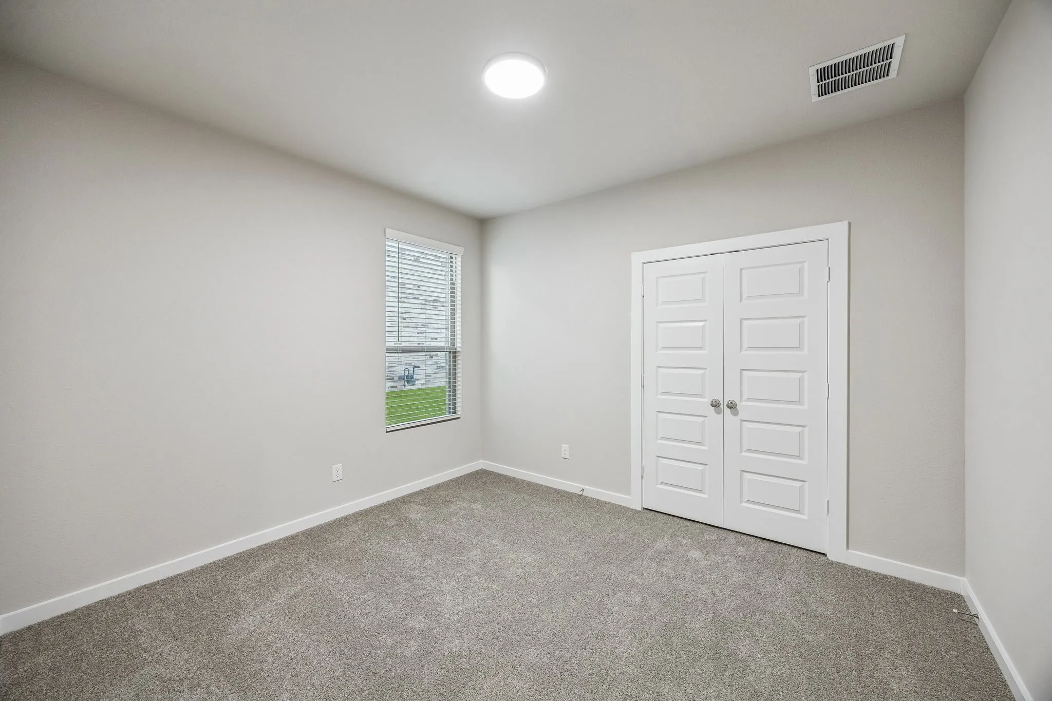 Bedroom in the Wimbledon home plan by Trophy Signature Homes – REPRESENTATIVE PHOTO