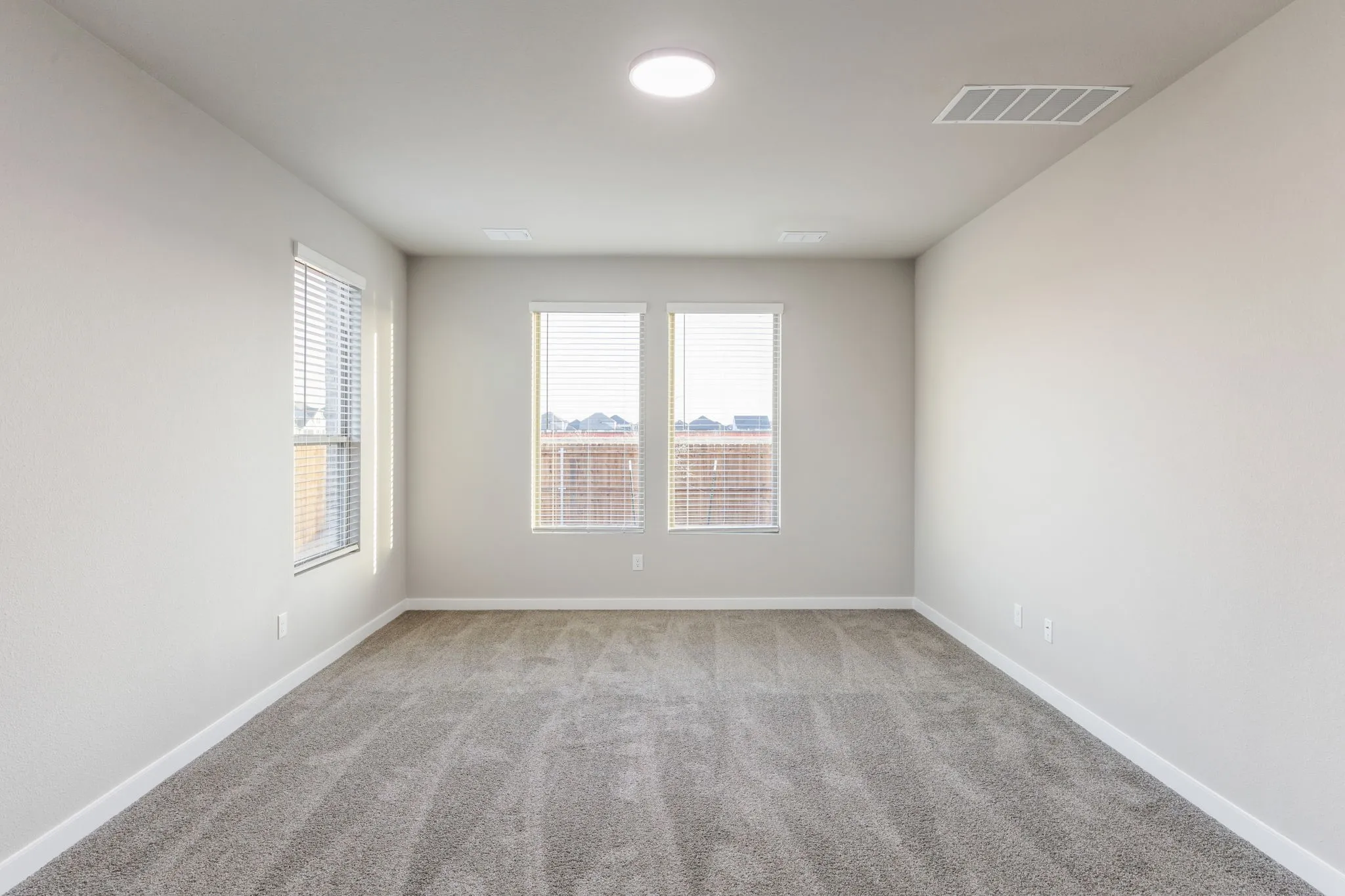 Primary Suite in the Wimbledon home plan by Trophy Signature Homes – REPRESENTATIVE PHOTO