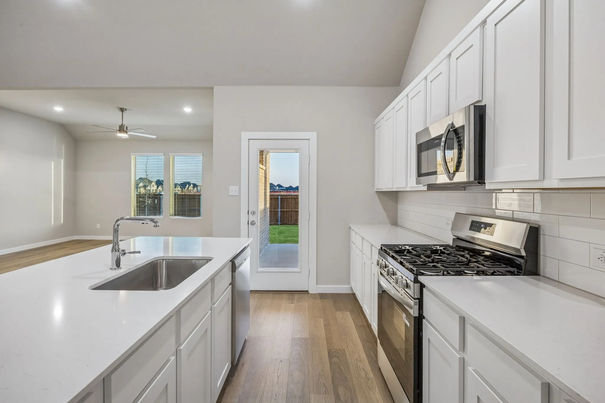 Kitchen in the Wimbledon home plan by Trophy Signature Homes – REPRESENTATIVE PHOTO