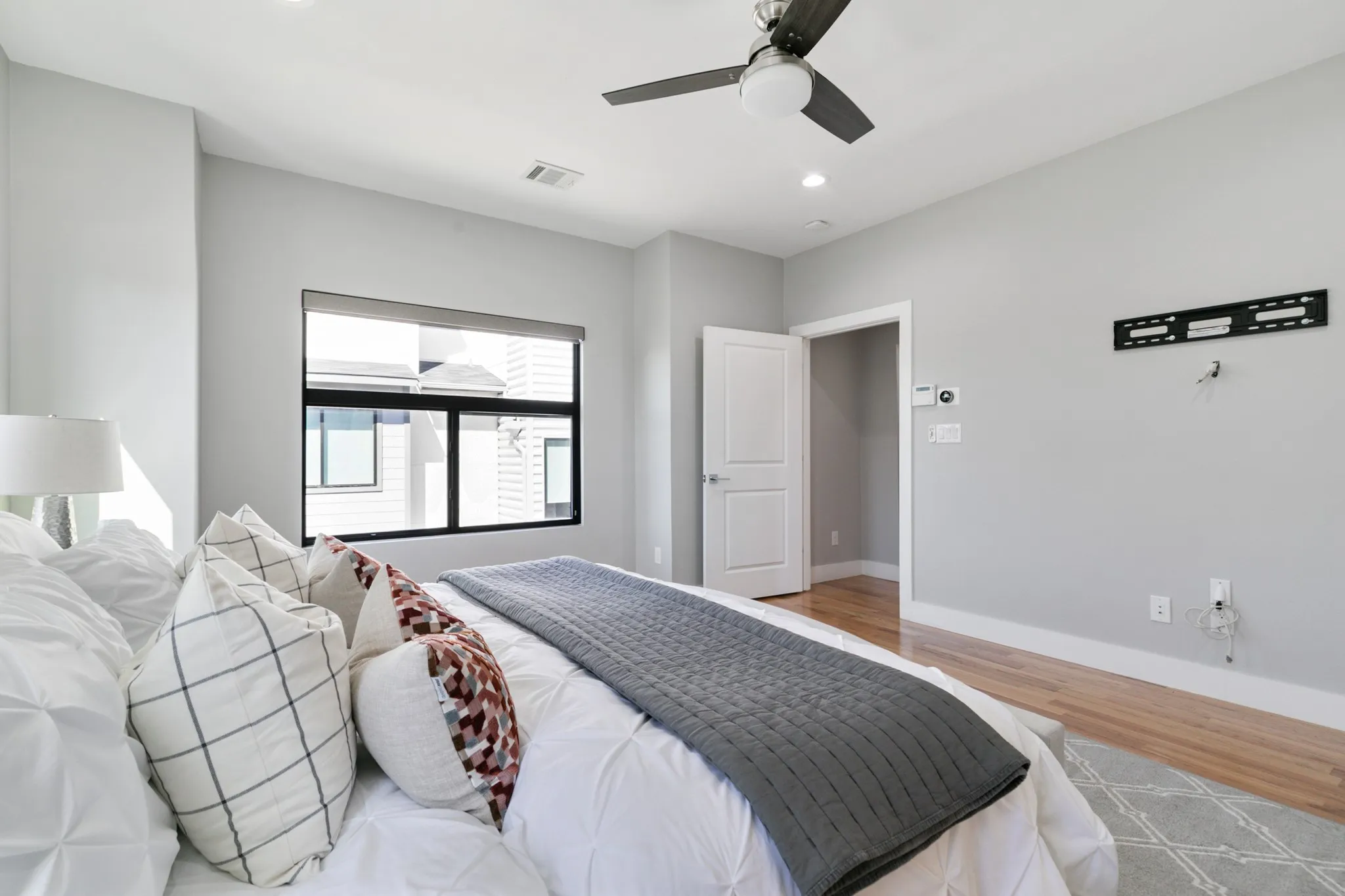 Hardwood flooring, recessed lighting, and a ceiling fan with integrated lighting
