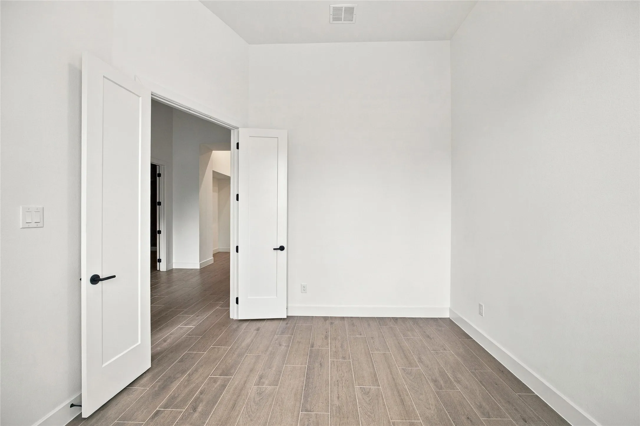  Wood-finish flooring and modern flat panel doors