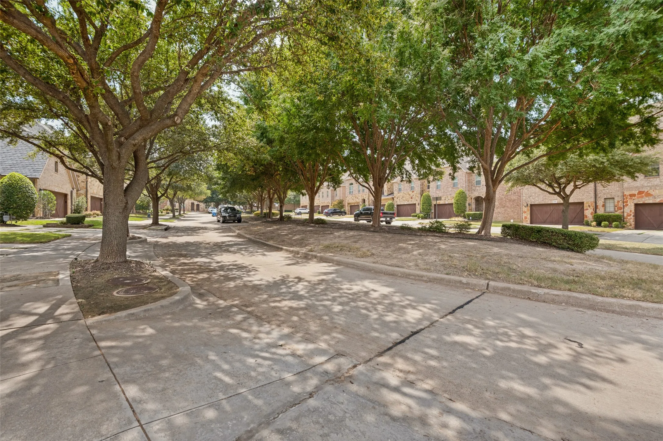 Tree lined street with parking and shade