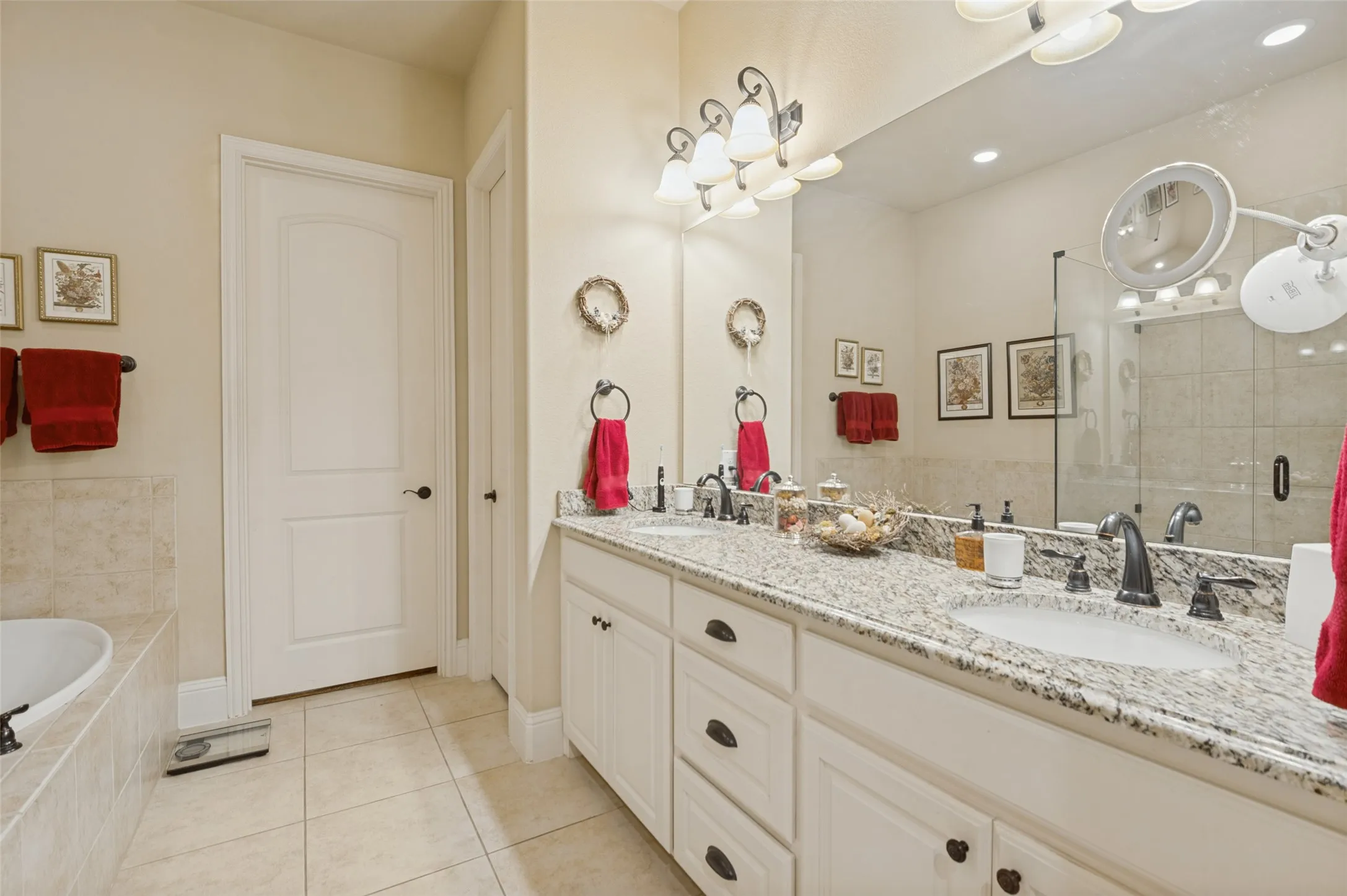 Granite countertops and dual sinks with separate tub and shower