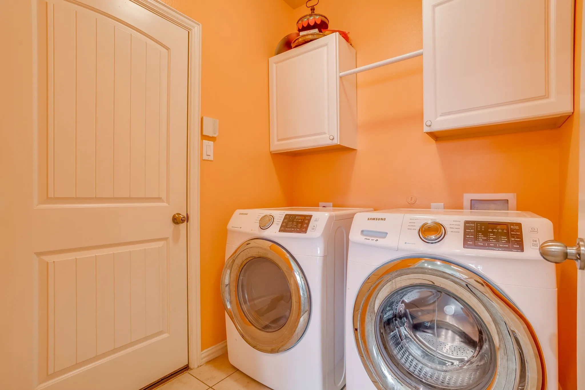 White shaker-style cabinetry with a hanging rod