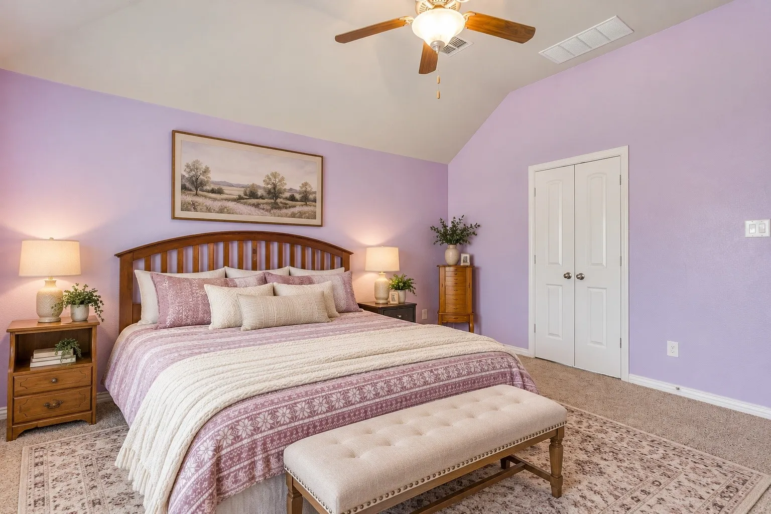 Vaulted ceiling, ceiling fan, carpet flooring, double-door closet, wood-finish bed frame. Picture virtually edited