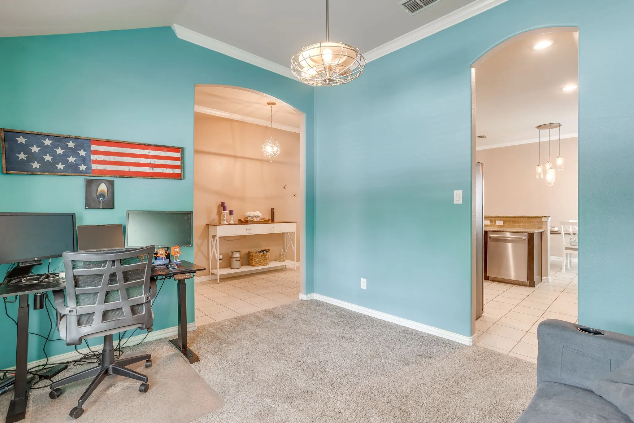 Archway entryways, recessed ceiling lighting, light-toned wall finishes, and tile flooring