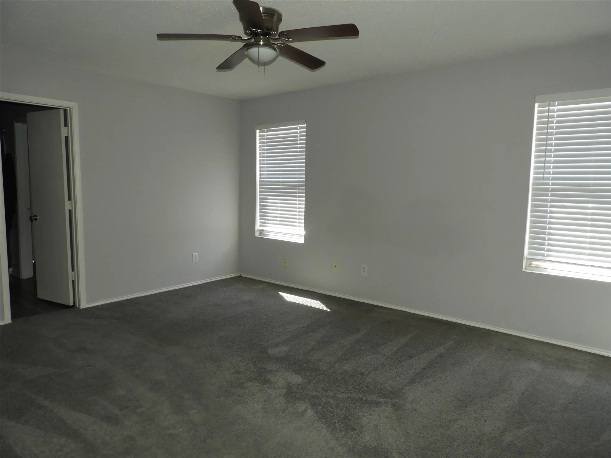 Primary Bedroom with lots of natural light, ceiling fan and walk in​​‌​​​​‌​​‌‌​‌‌​​​‌‌​‌​‌​‌​​​‌​​ closet.