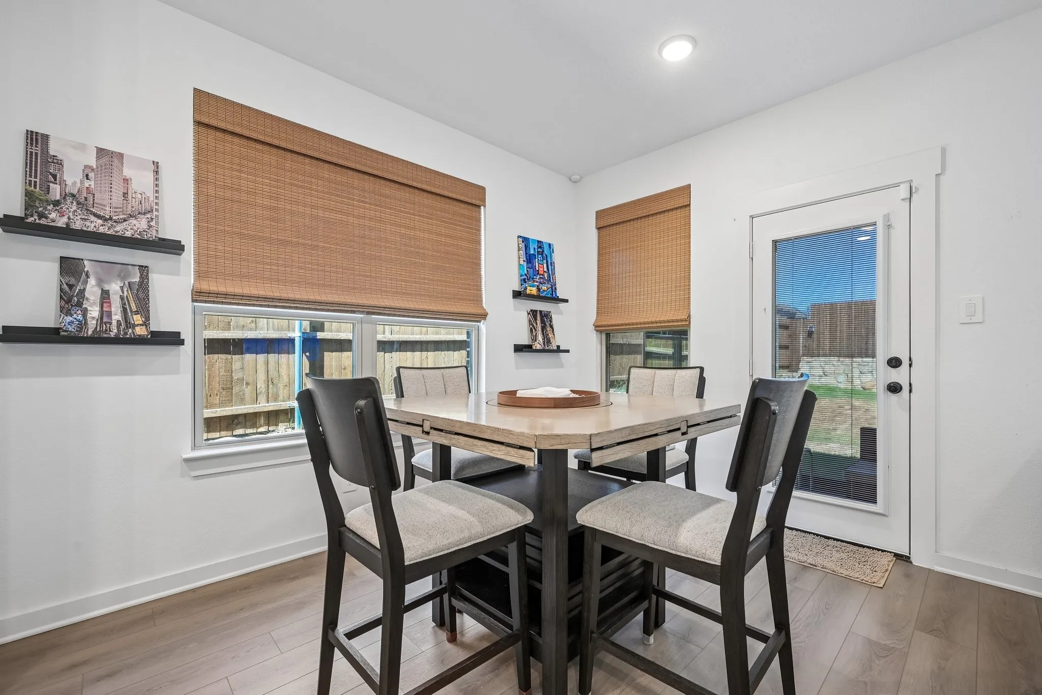 Wood-finish flooring, recessed lighting, and a full-light exterior door