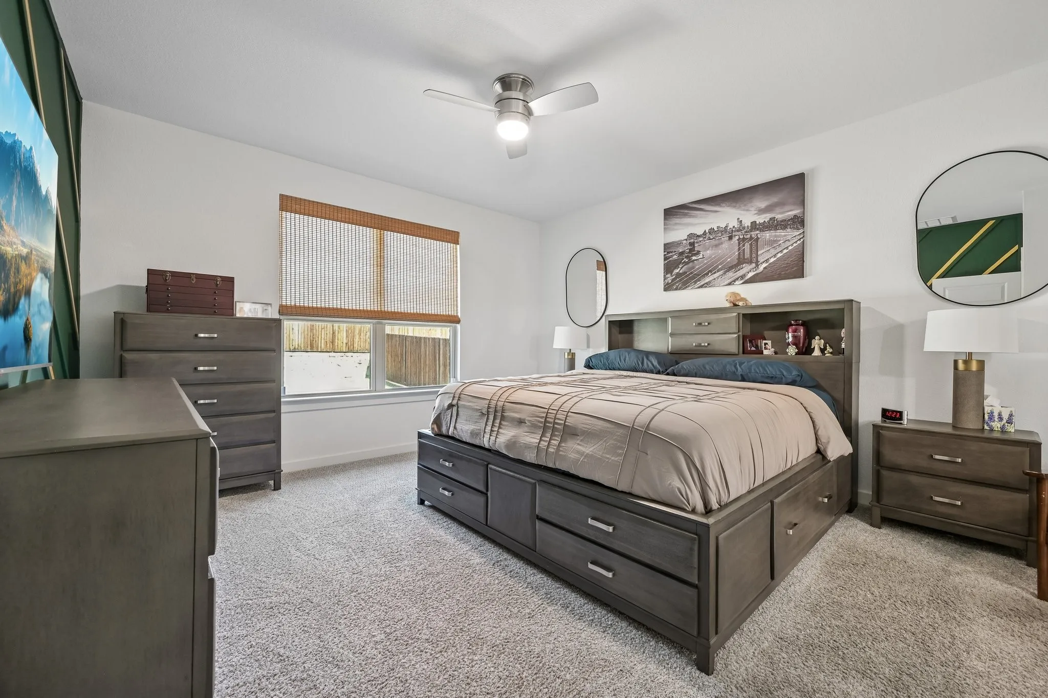 Wall-to-wall carpeting, ceiling fan with integrated lighting, and a single window with blinds