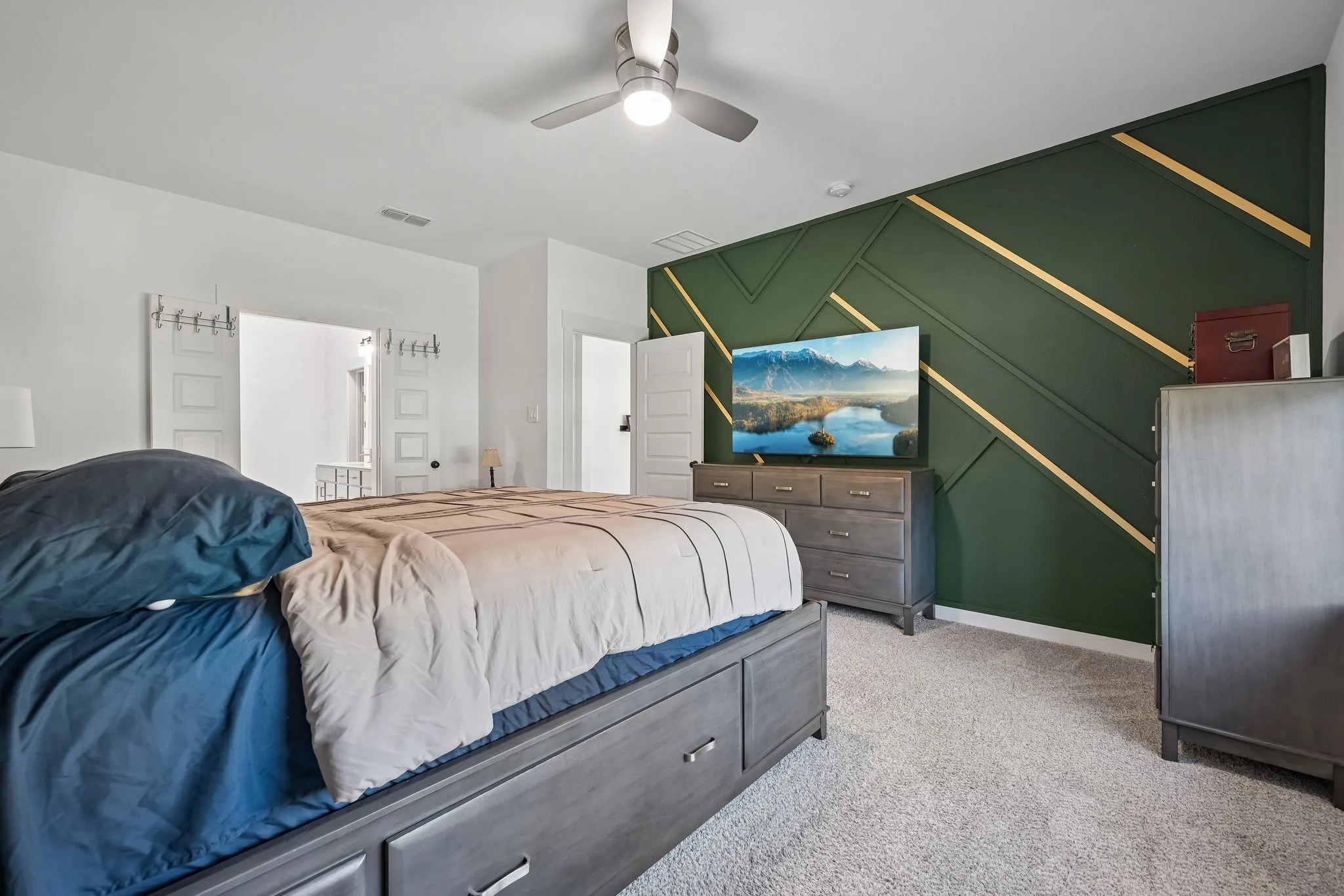 Accent wall with geometric trim and gold-tone detailing