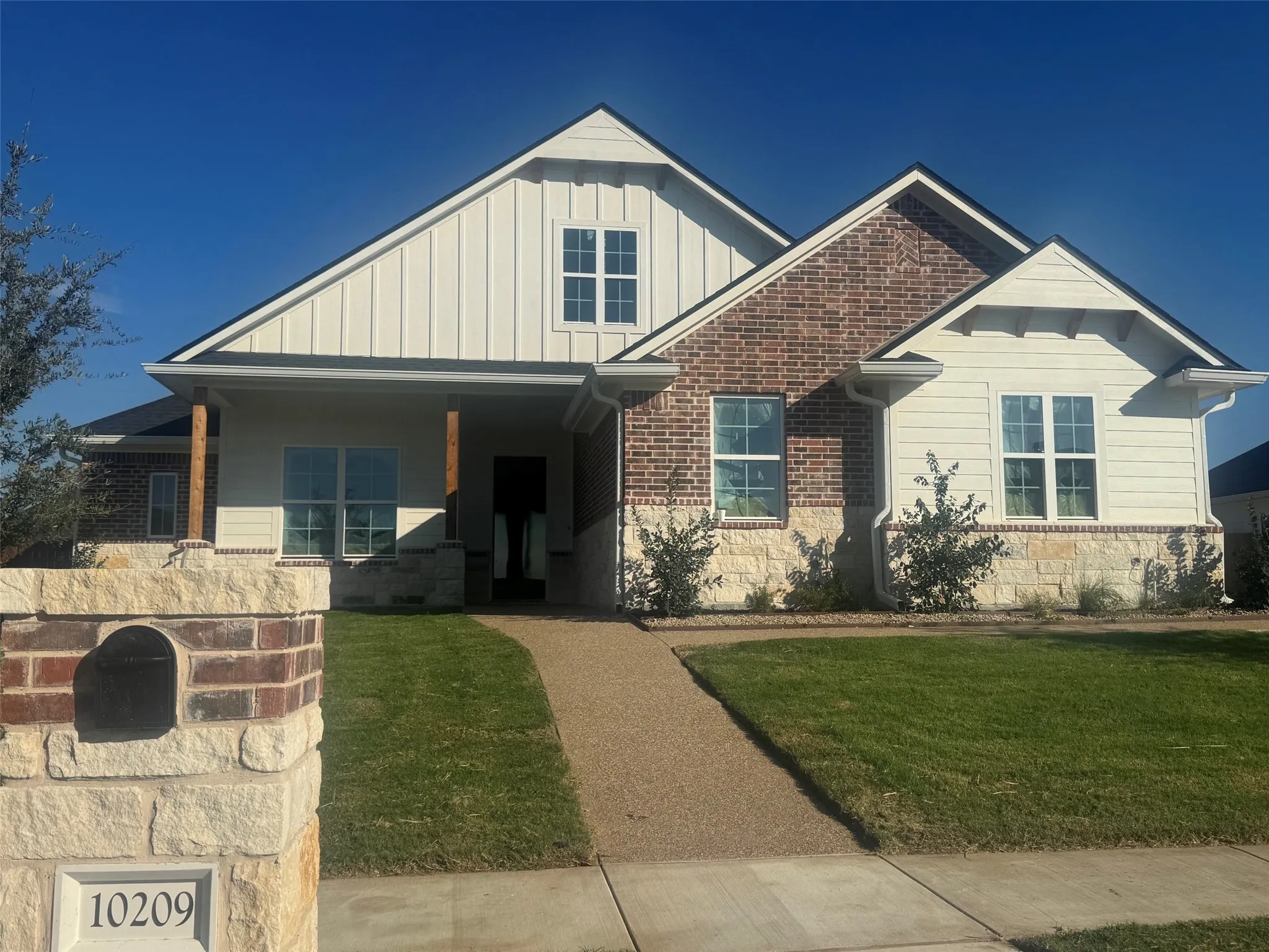 Brick and stone exterior with board and batten siding