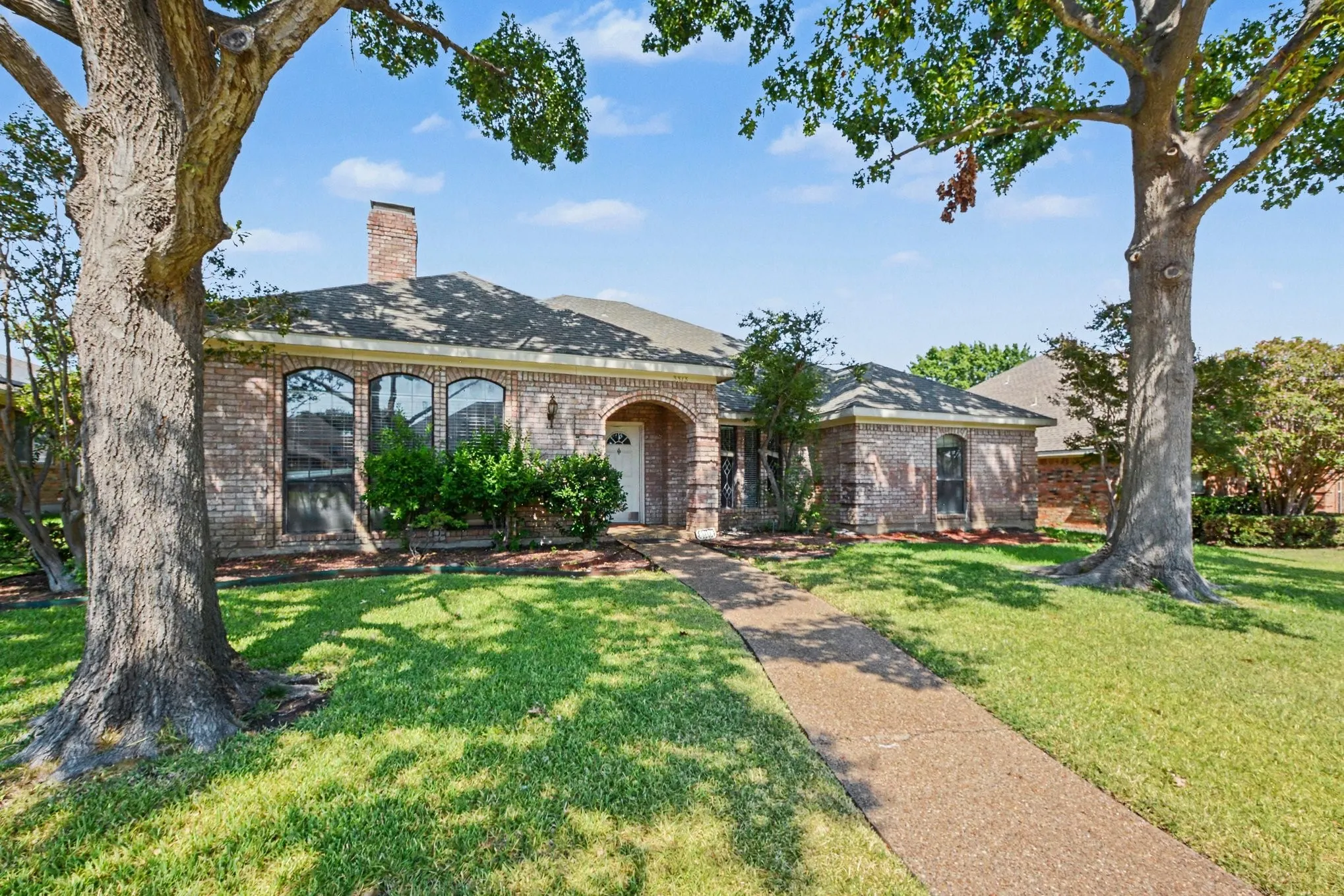 Brick exterior with arched entry