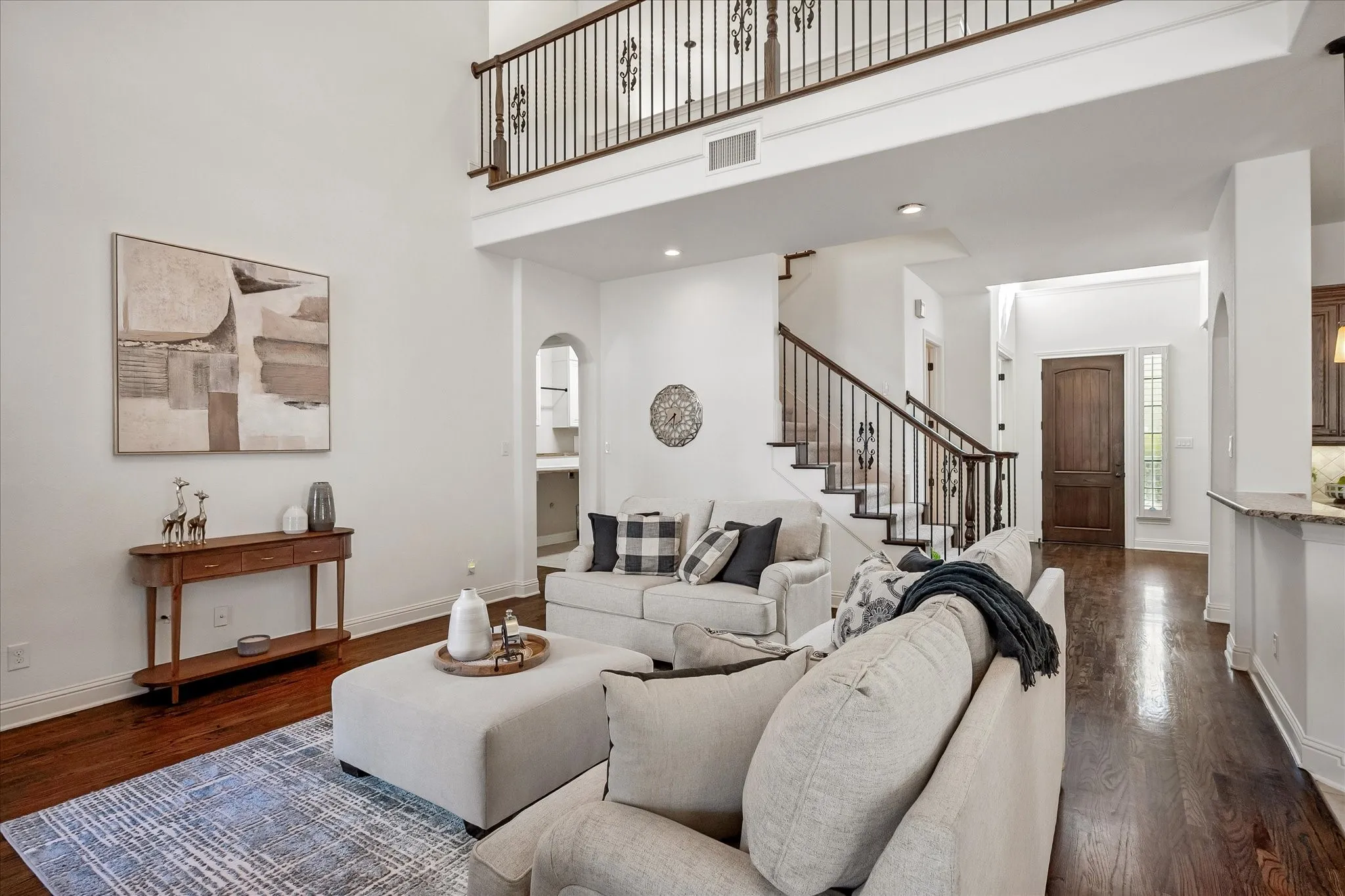 Spacious open concept main living room with 2 story ceiling overlooking the  spacious backyard.