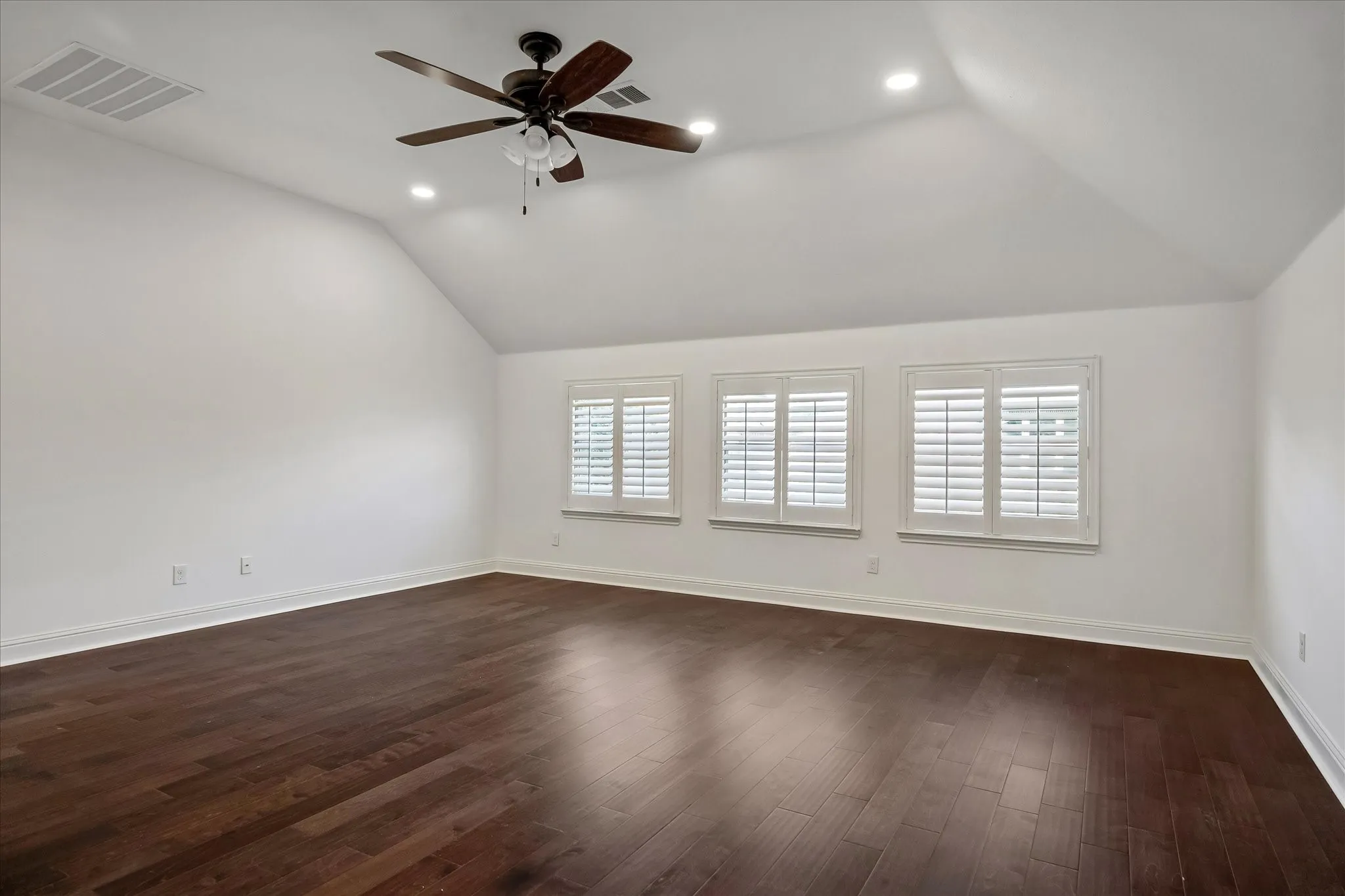 Large upstairs gameroom or second living with views of the backyard.