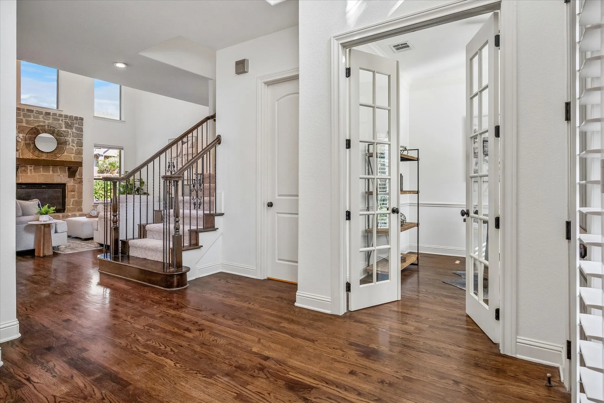 Light and bright foyer with a private study, half bath, and formal dining area.