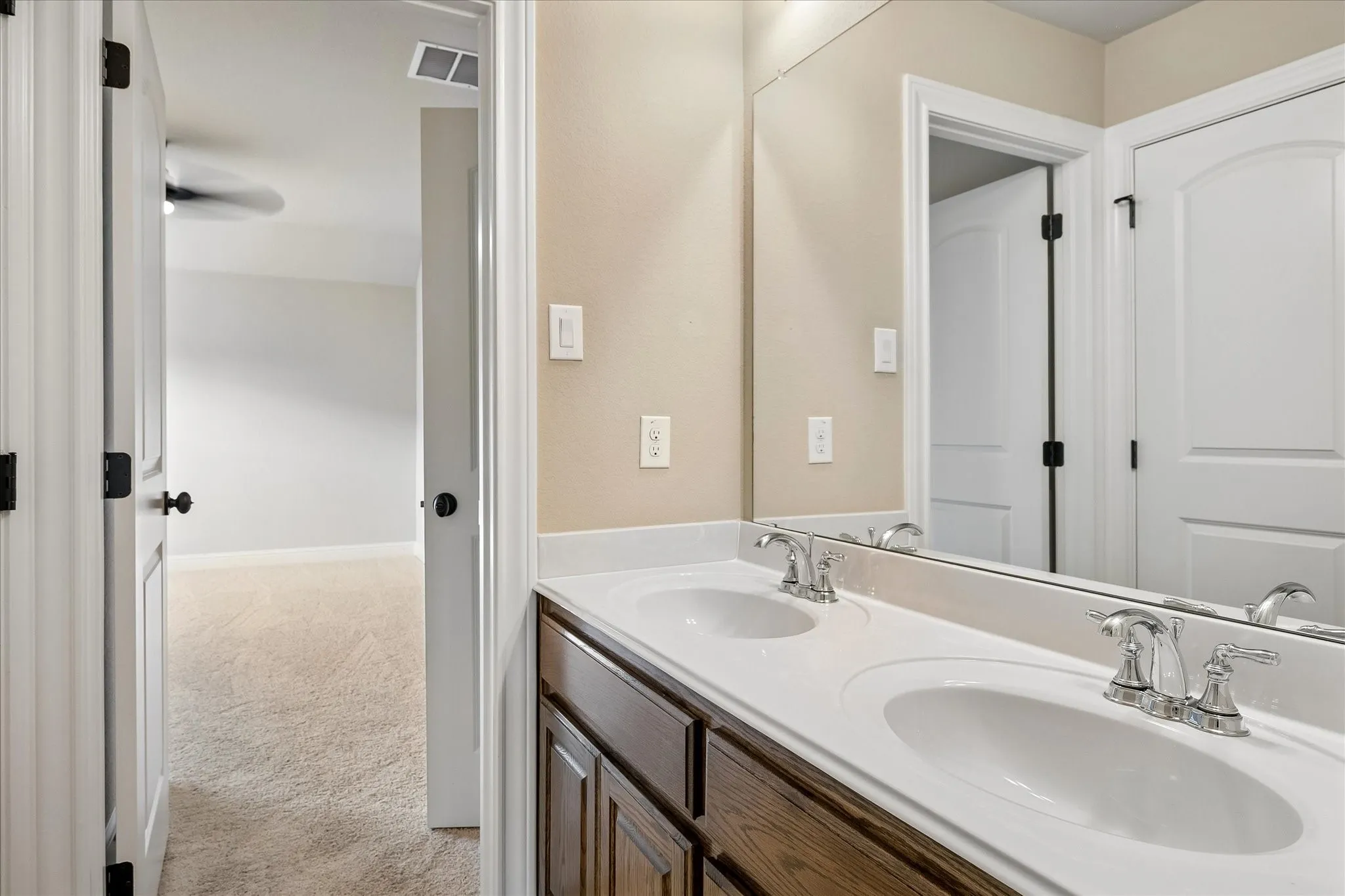 Jack and jill bathroom upstairs. Dual sinks with a separate doored shower area.