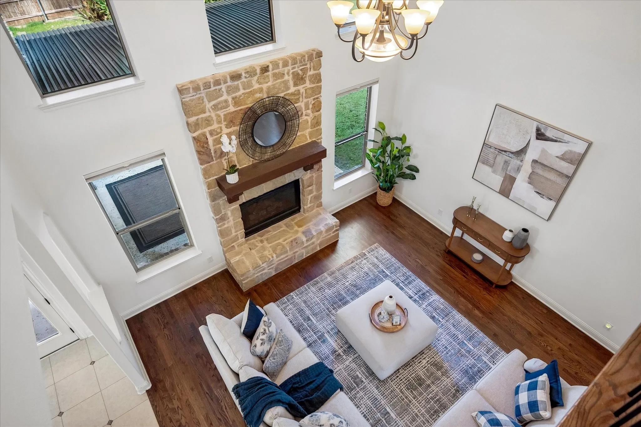 Spacious living space with a stone fireplace.