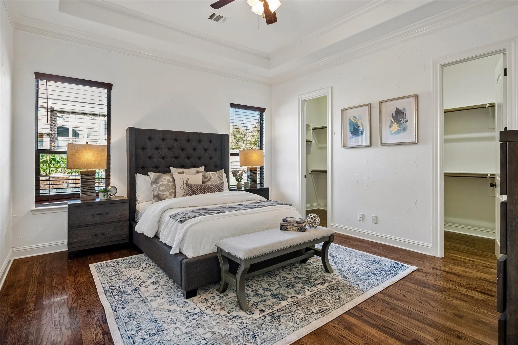 Primary bedroom with separate walk in closets.