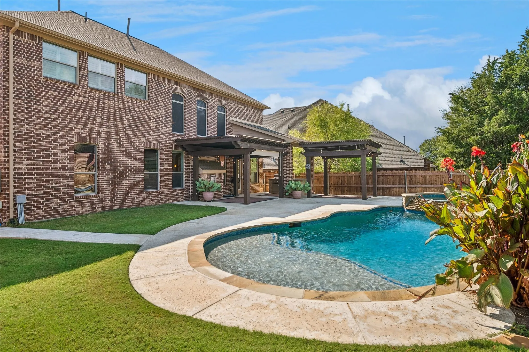 Your dream pool with  fabulous outdoor living spaces and an outdoor kitchen area.