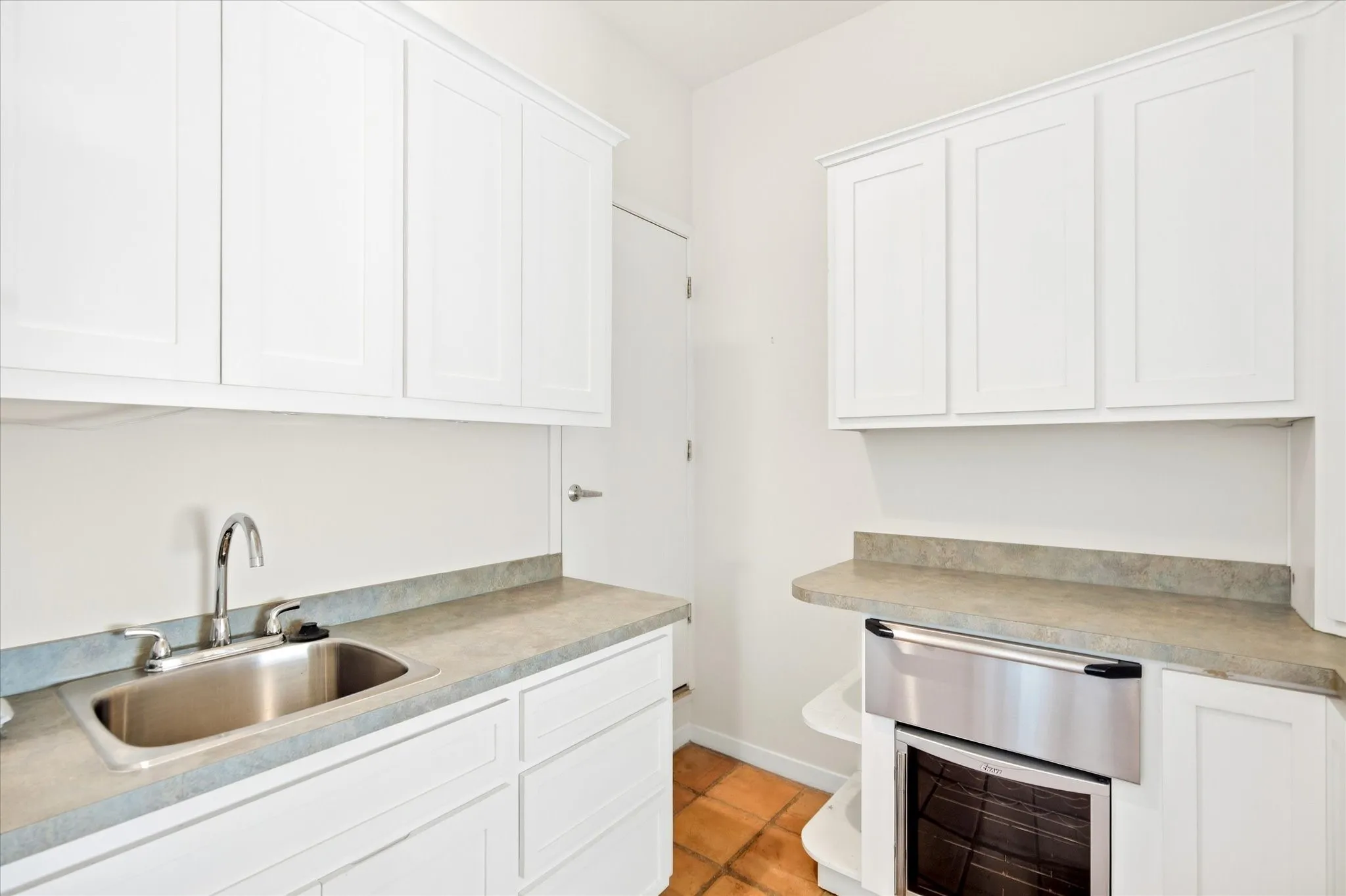 Wine refrigerator and warming drawer.