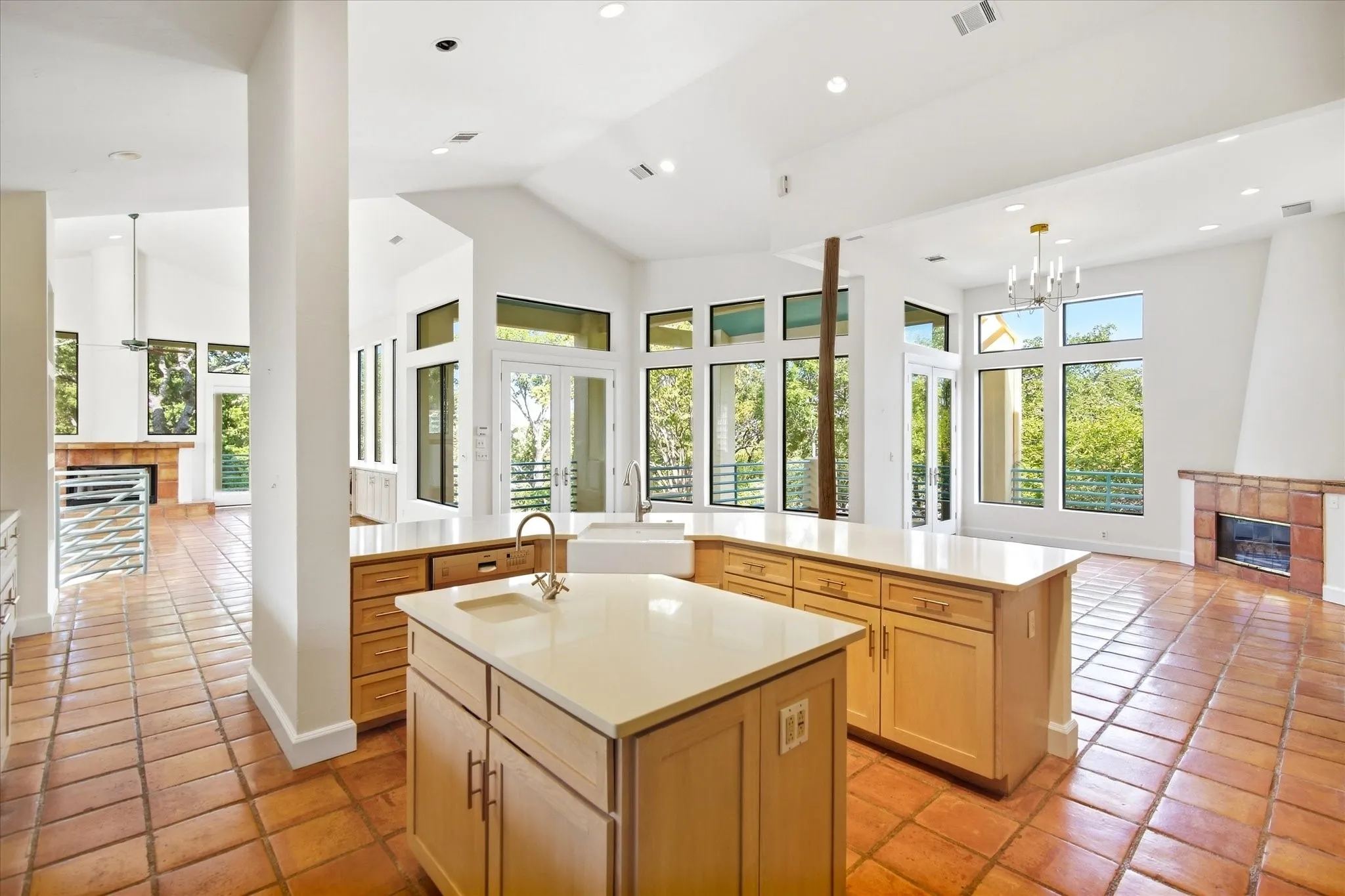 Kitchen featuring dual islands with light-toned countertops, recessed lighting, and tile flooring