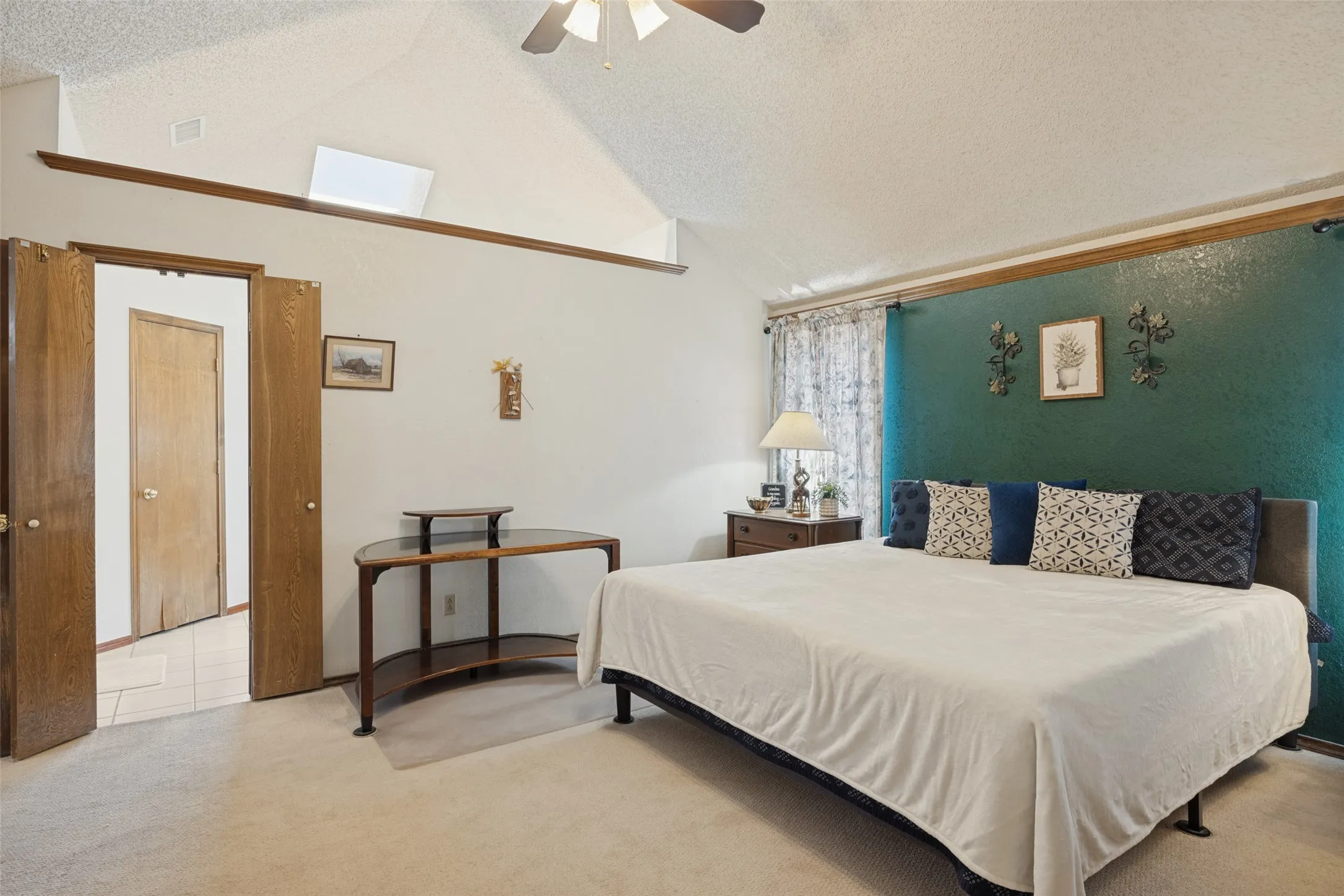 Oversize room with vaulted ceiling.