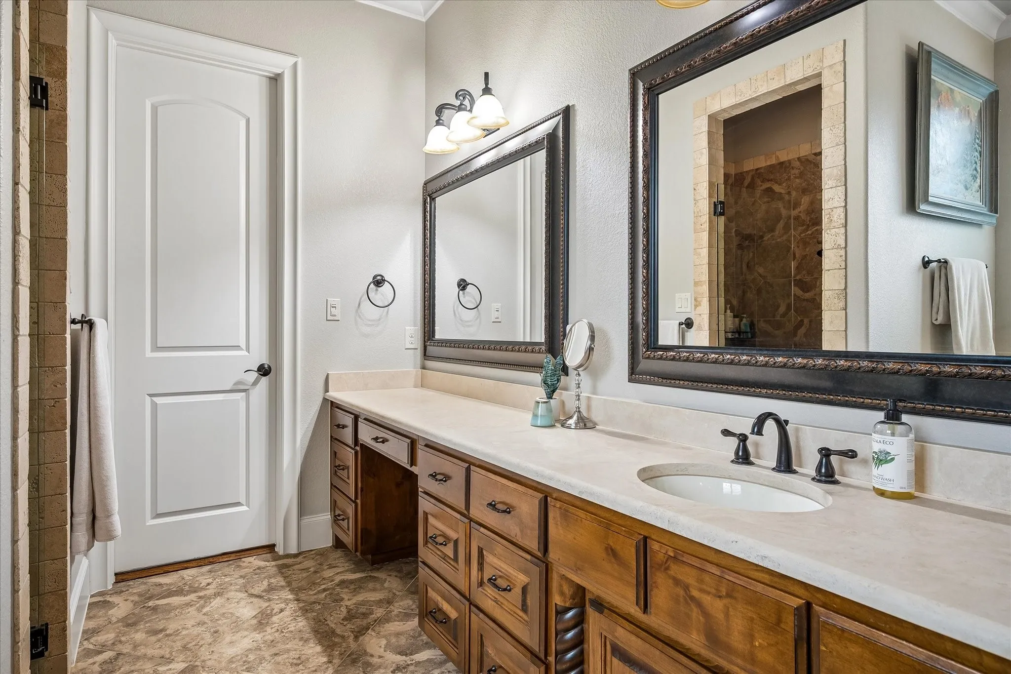 Dual vanities, walk-in shower, separate soaking tub.