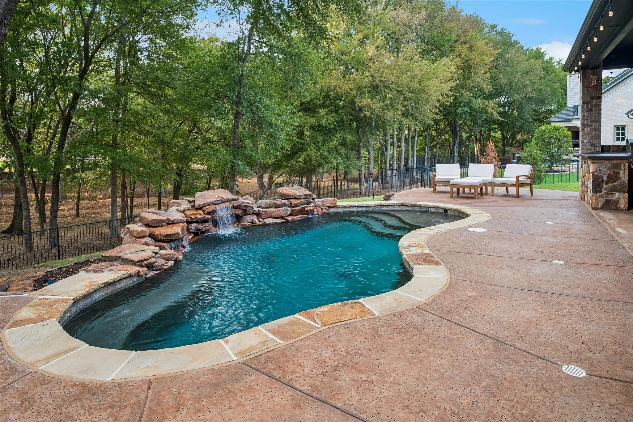 Yard backs to heavily wooded parkland with direct gated access to Trophy Club's renowned trail system